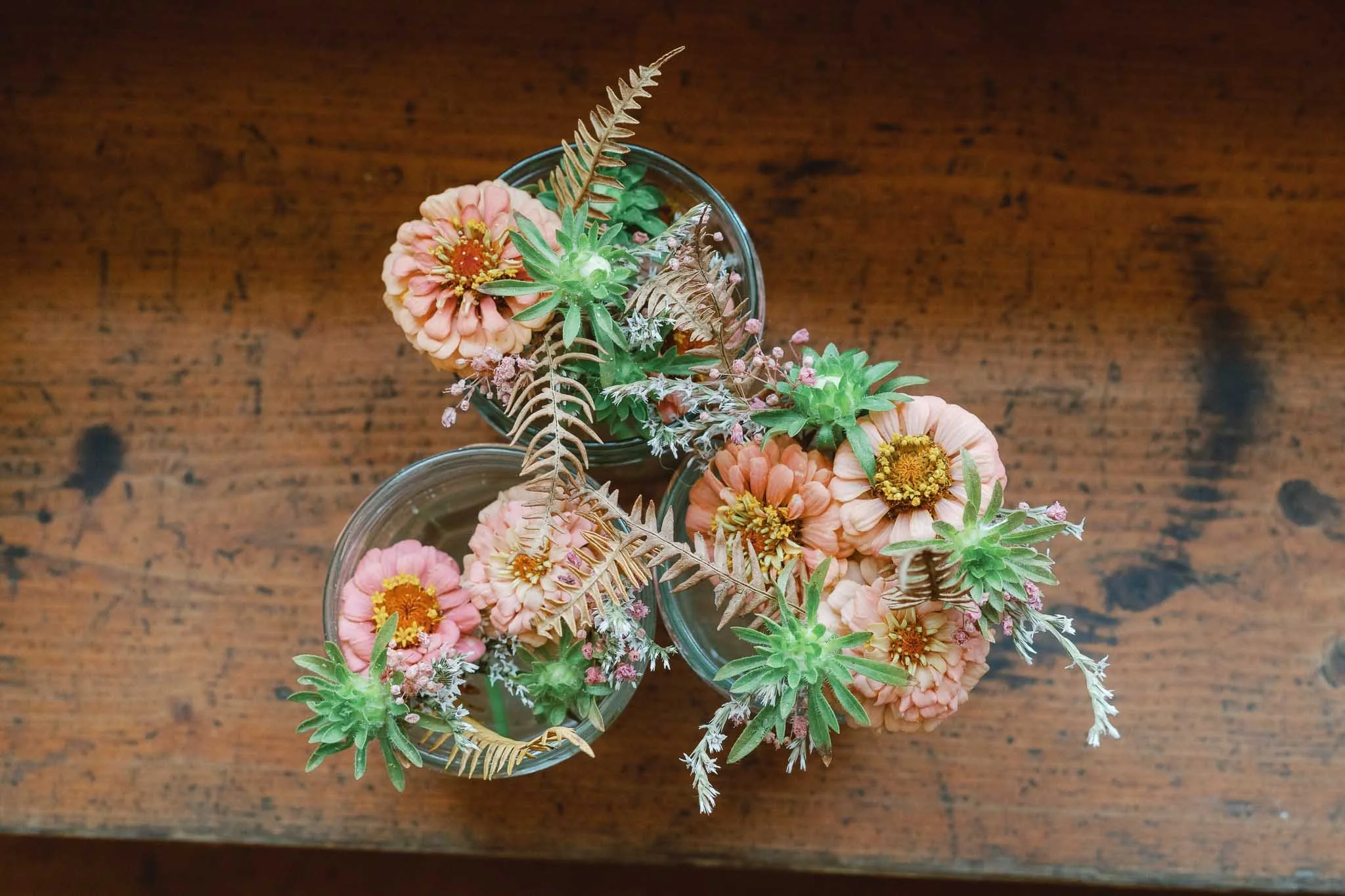 Macro detail photograph of flowers on a wooden table