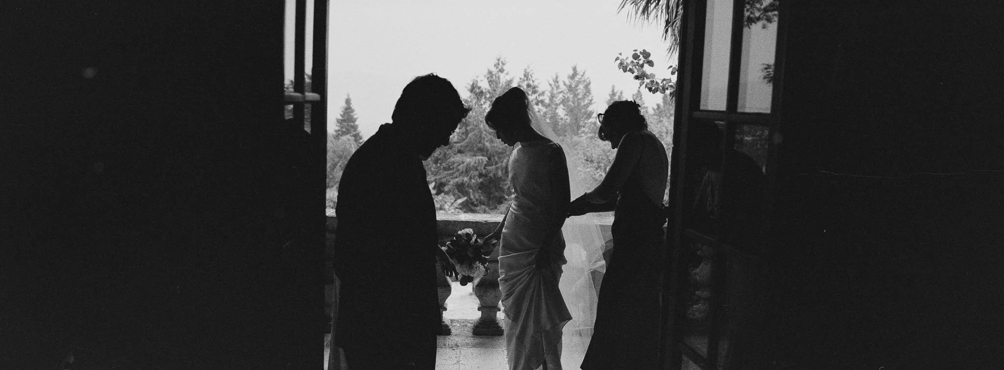 Panoramic film silhouette of bride on the balcony at Château du Raysse, shot on Hasselblad XPan