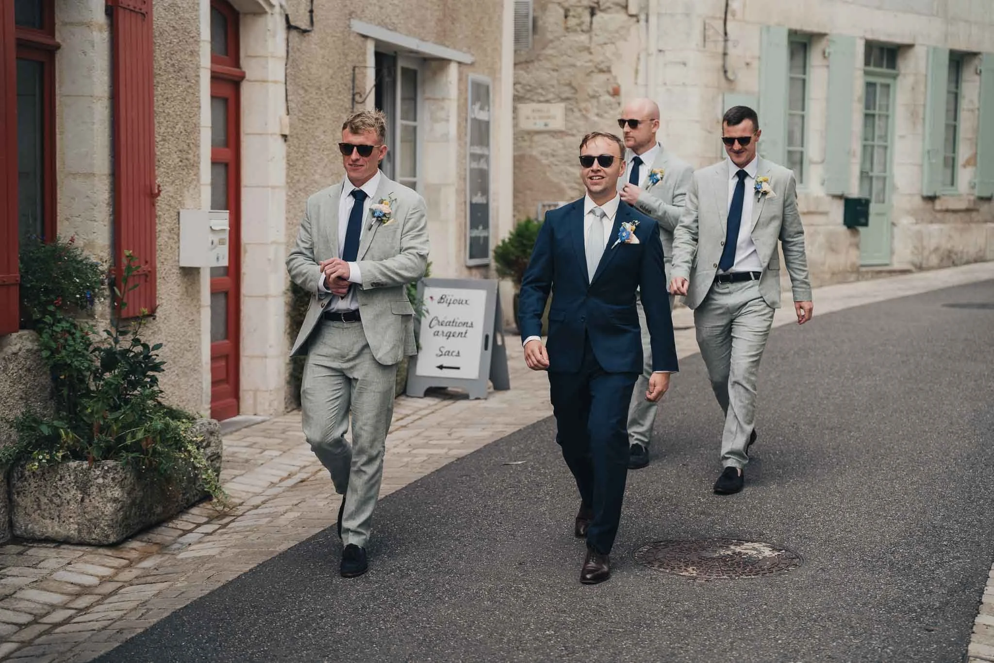 Groom and groomsmen walking through the streets of Aubeterre-sur-Dronne before the ceremony.