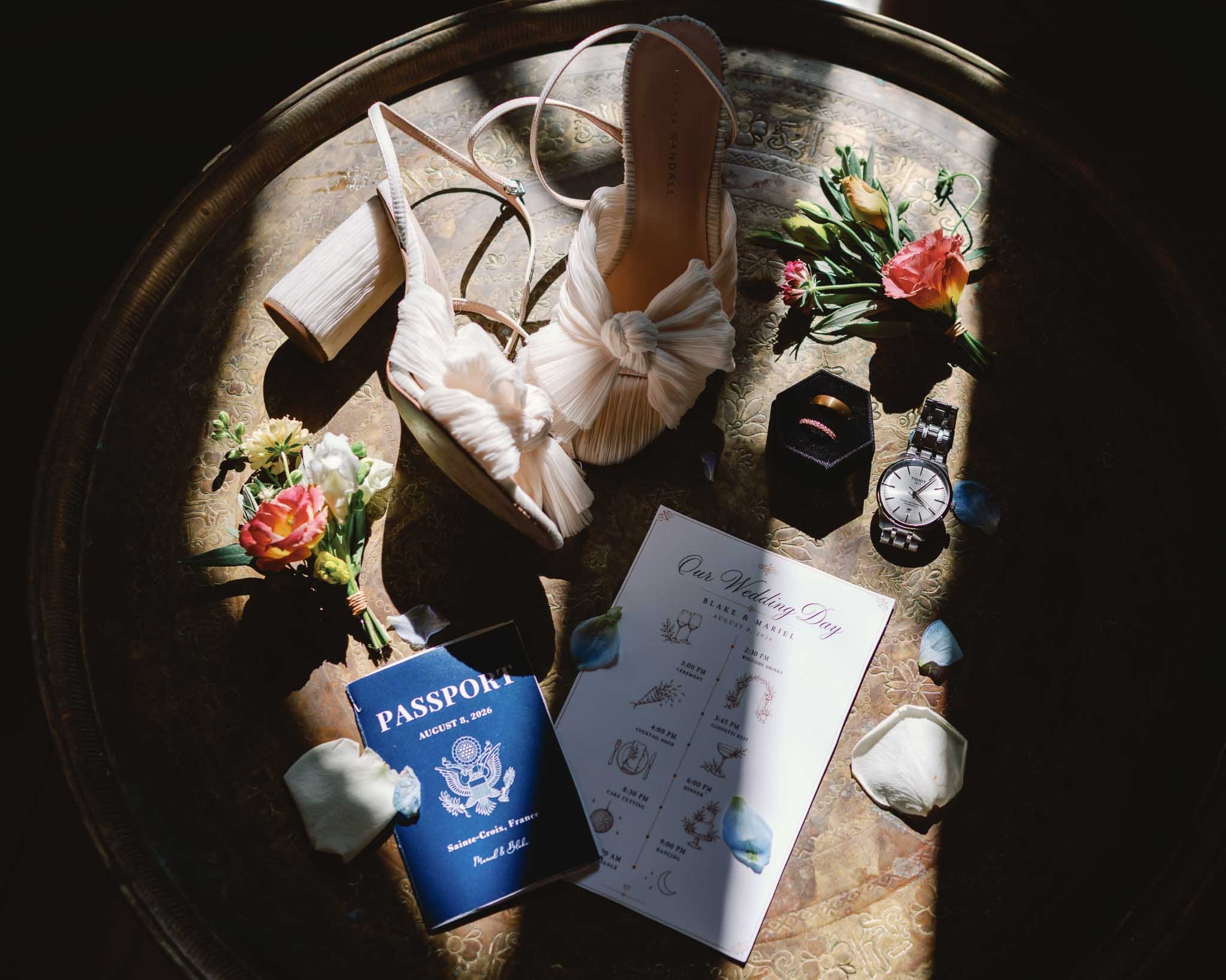 Wedding detail flat lay with passport and rings at Château de Sainte Croix, Southwest France