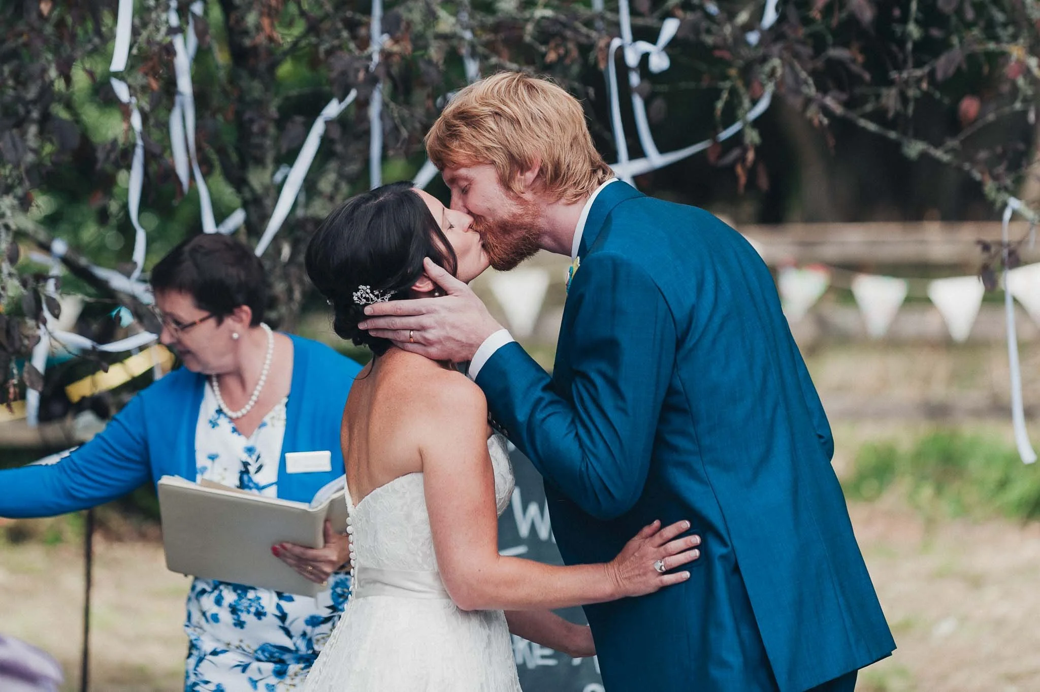 The bride and groom sharing their first kiss at the end of the ceremony.