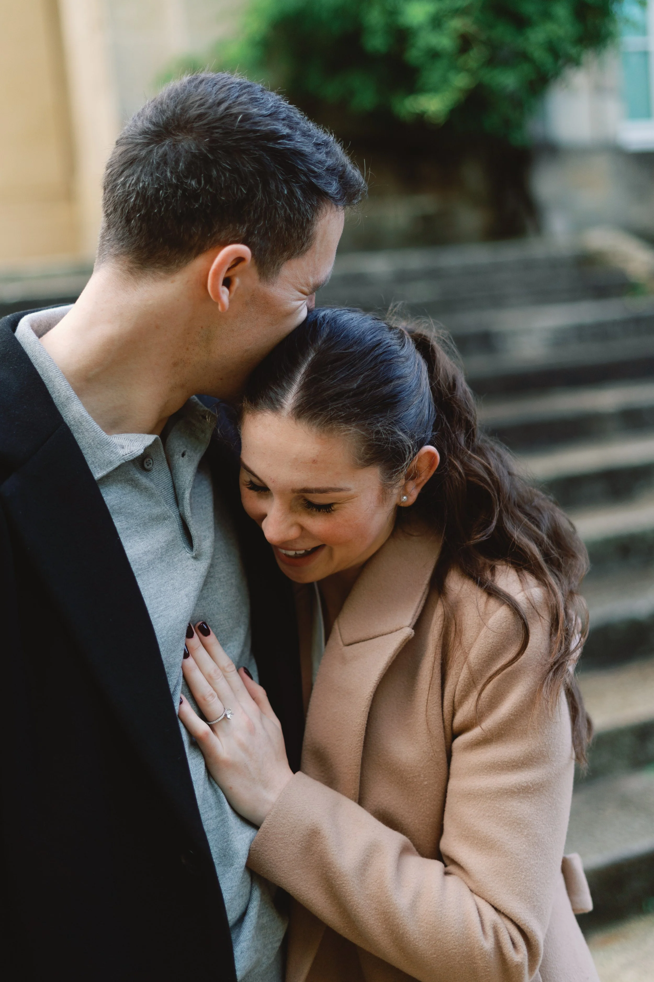 Newly engaged couple standing close together after a proposal in Bordeaux, photographed naturally.