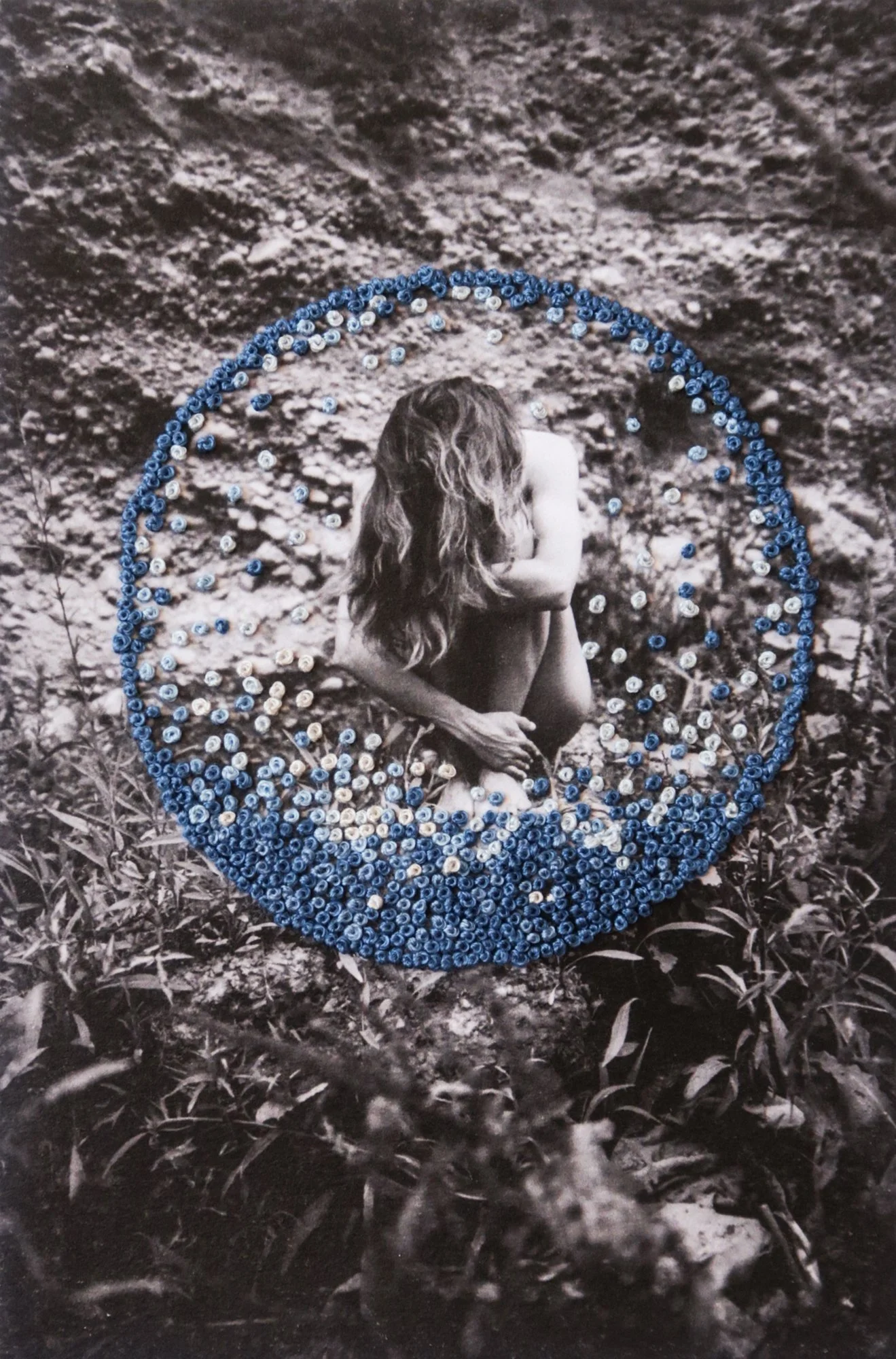 A photograph combining nude body, thread, and nature, photo embroidery on paper by Yanina Shevchenko, an artwork from her project We Are One