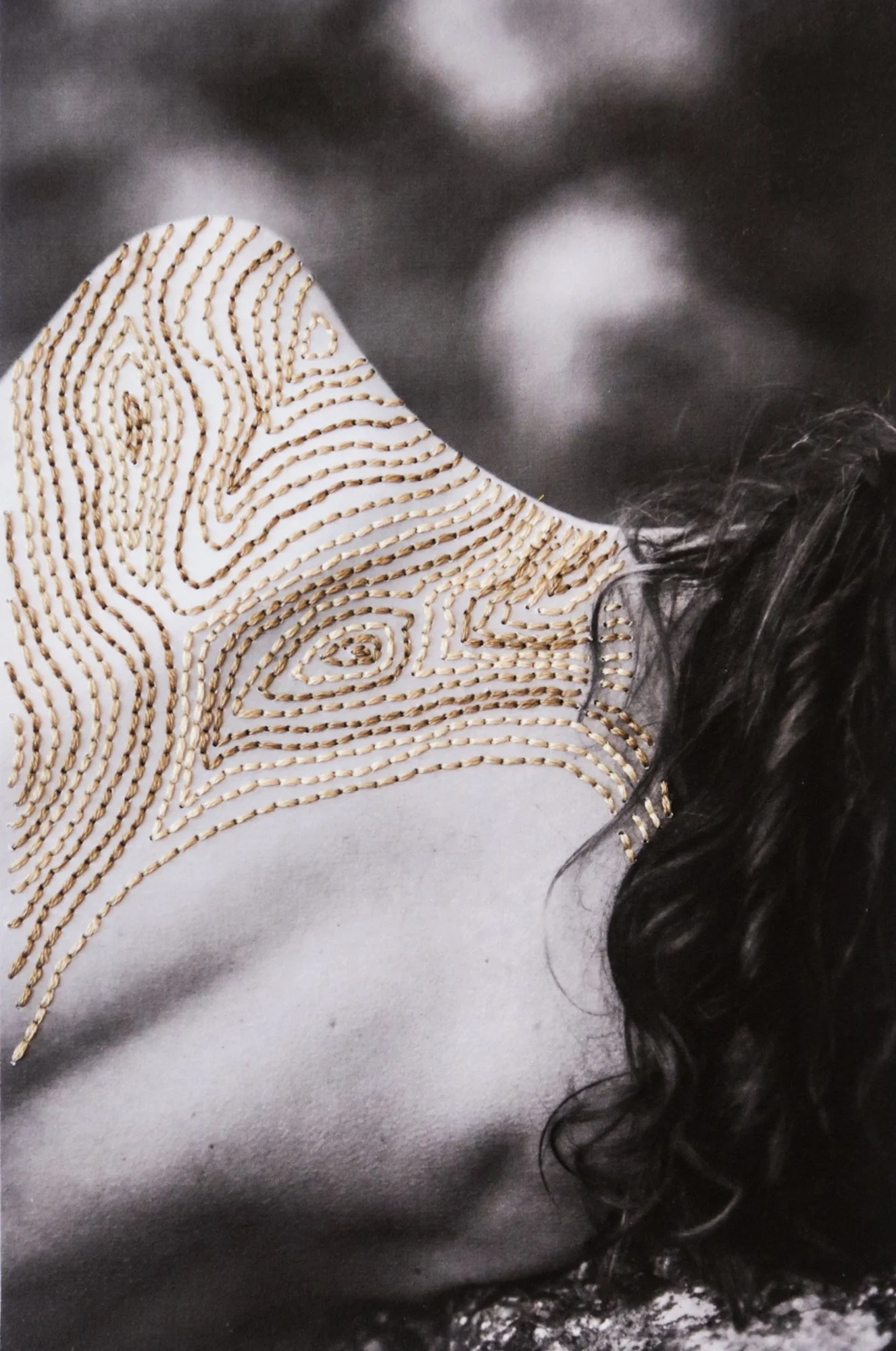 A photograph combining nude body, thread, and nature, photo embroidery on paper by Yanina Shevchenko, an artwork from her project We Are One