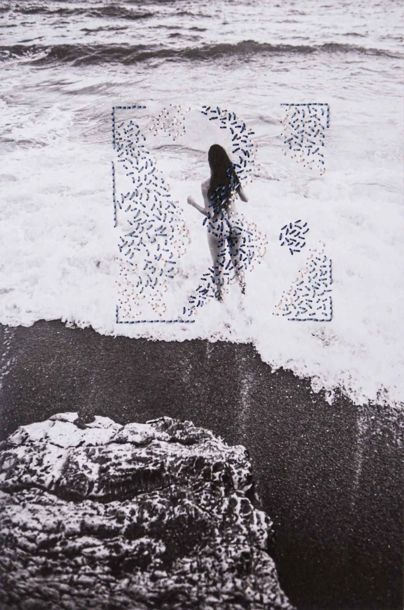 A photograph combining nude body, thread, and nature, photo embroidery on paper by Yanina Shevchenko, an artwork from her project We Are One