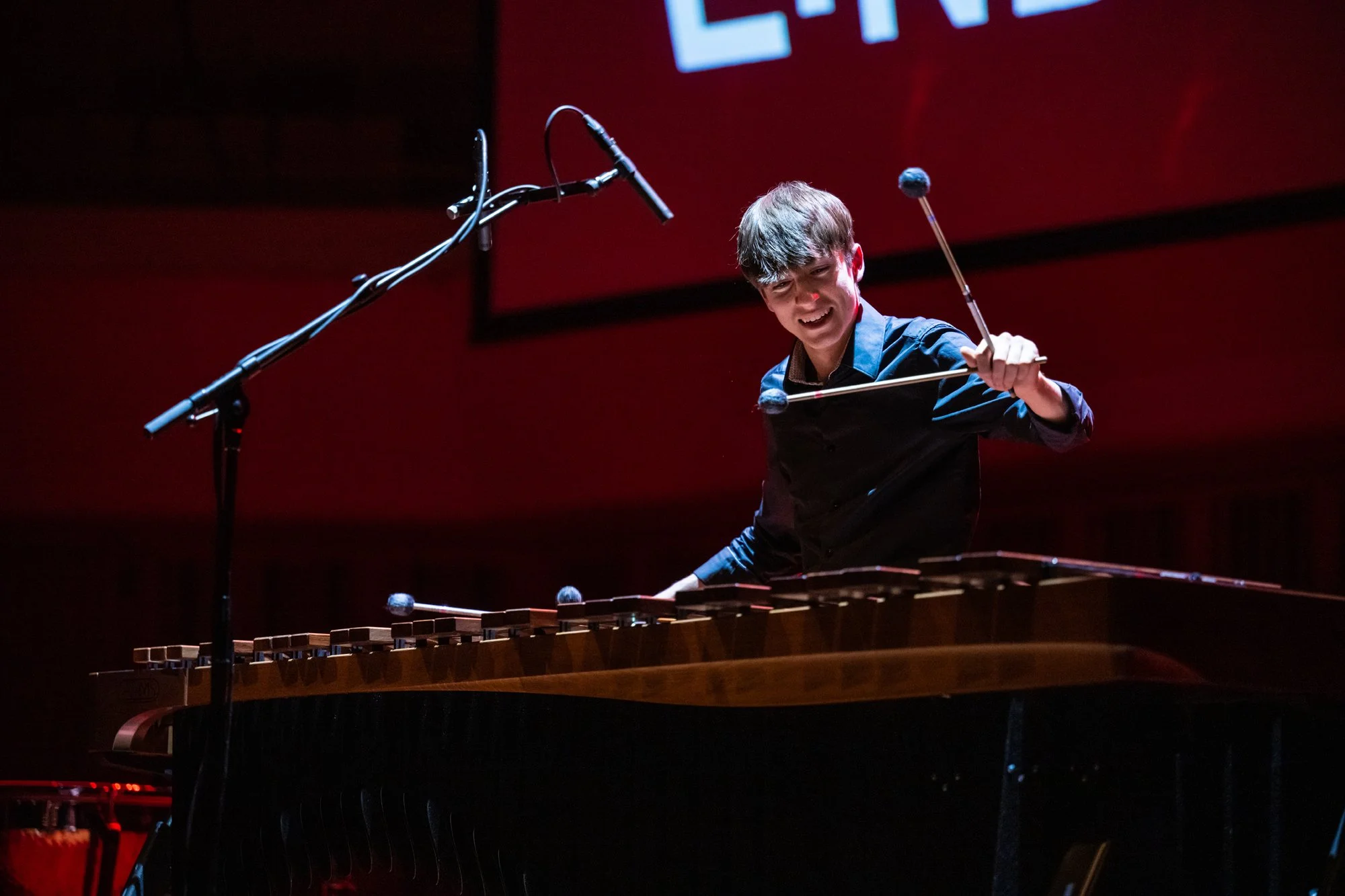 Gabriel Michaud playing a marimba on stage during the final of the Tromp Percussion Eindhoven 2022 competition
