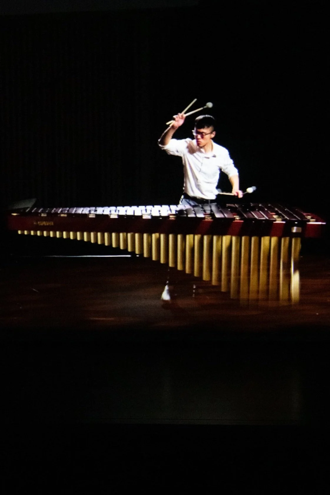Meng-Fu Hsieh playing marimba on stage as a hologram during the final of the Tromp Percussion Eindhoven 2020 competition