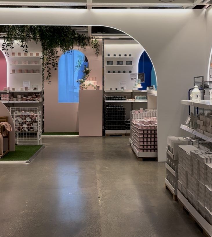 Retail focal point design in IKEA candle shop with entrance video screen guiding customer navigation