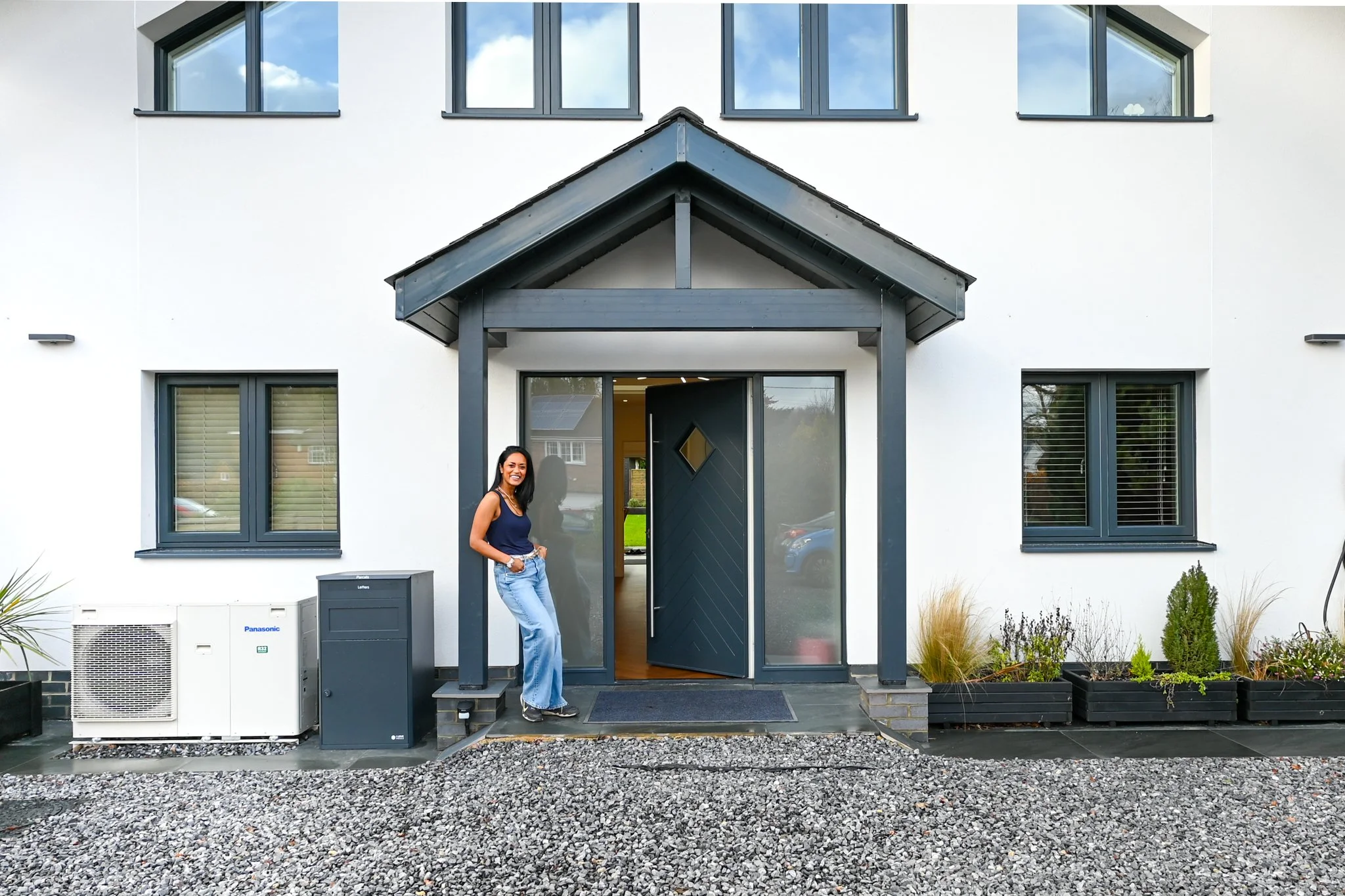 Maddy with her eco self-build home in Berkshire.