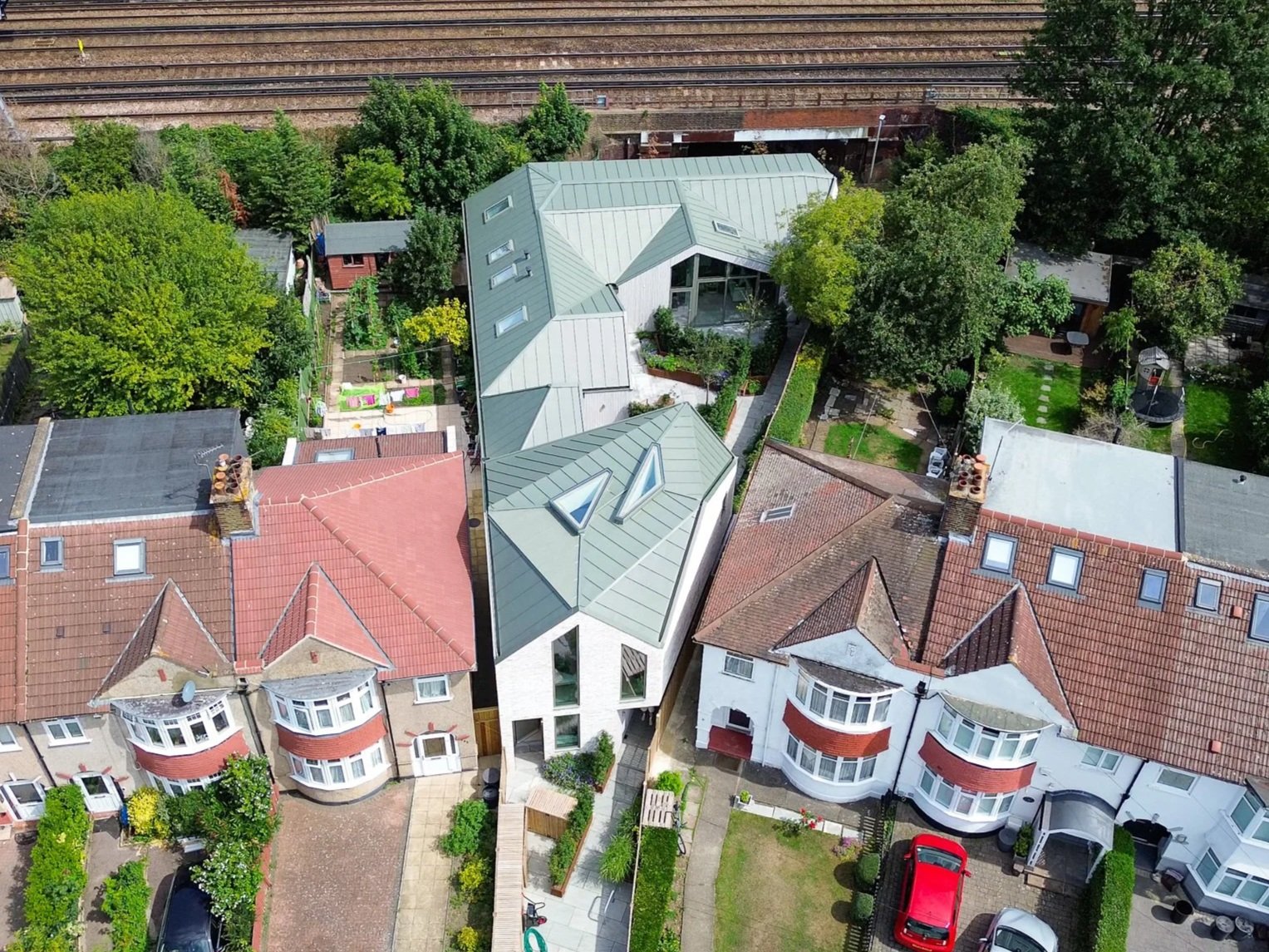 Rose Hip Yard: A Contemporary Development of Three Diamond-Shaped Homes on a Former Storage Yard.