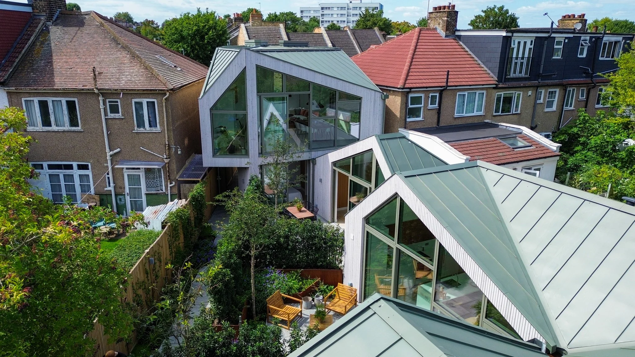 Rose Hip Yard: A Contemporary Development of Three Diamond-Shaped Homes on a Former Storage Yard.