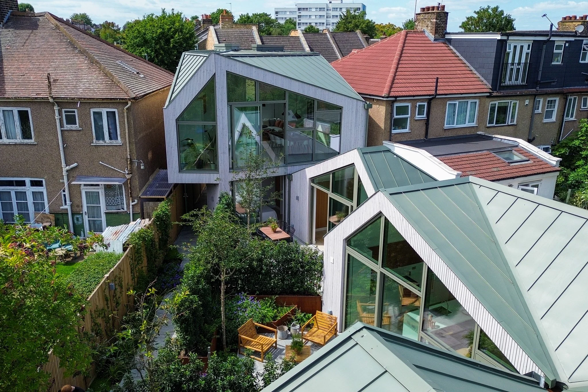 Rose Hip Yard: A Contemporary Development of Three Diamond-Shaped Homes on a Former Storage Yard.