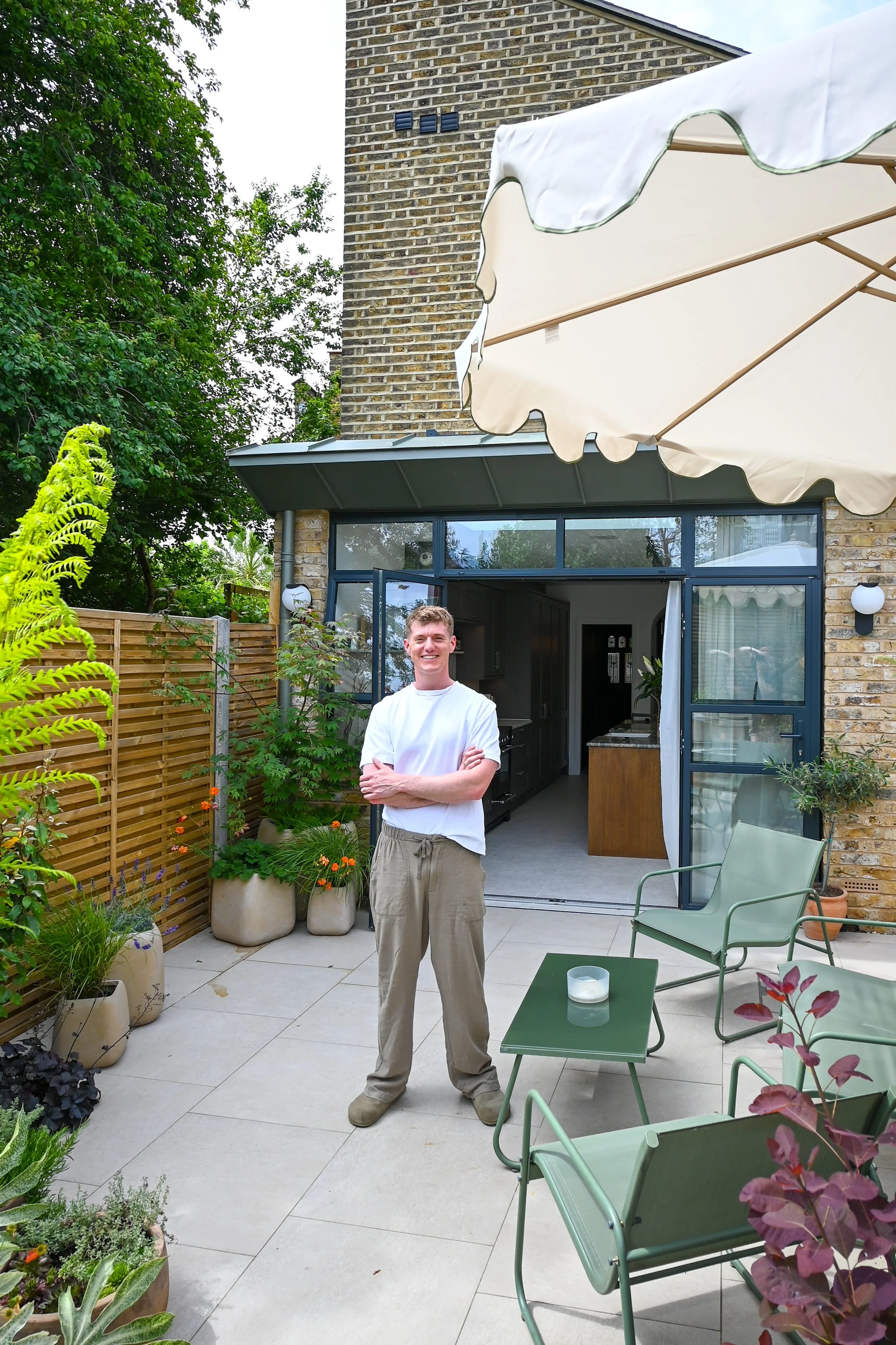 Danny in front of bottlebrush house, his home in london and a contemporary zinc rear extension