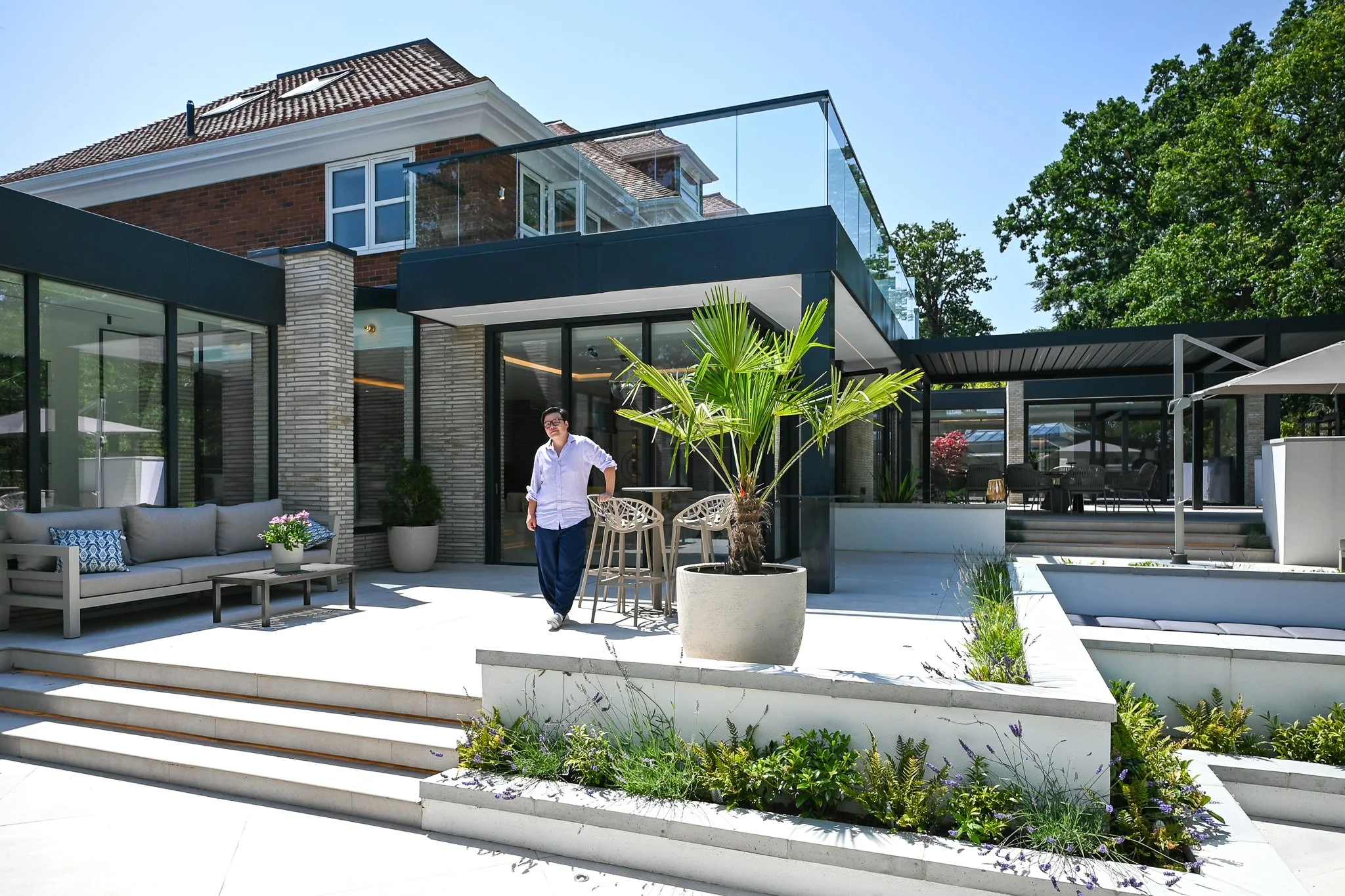 Youno Kim Architect standing in front of his rear elevation project in kingston
