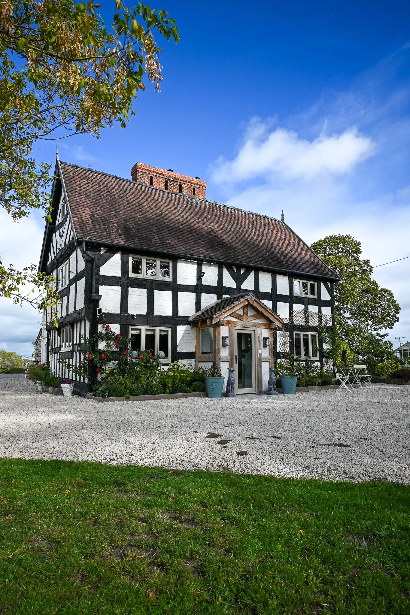 exterior angle of grade 2 listed cottage with blue sky and trees