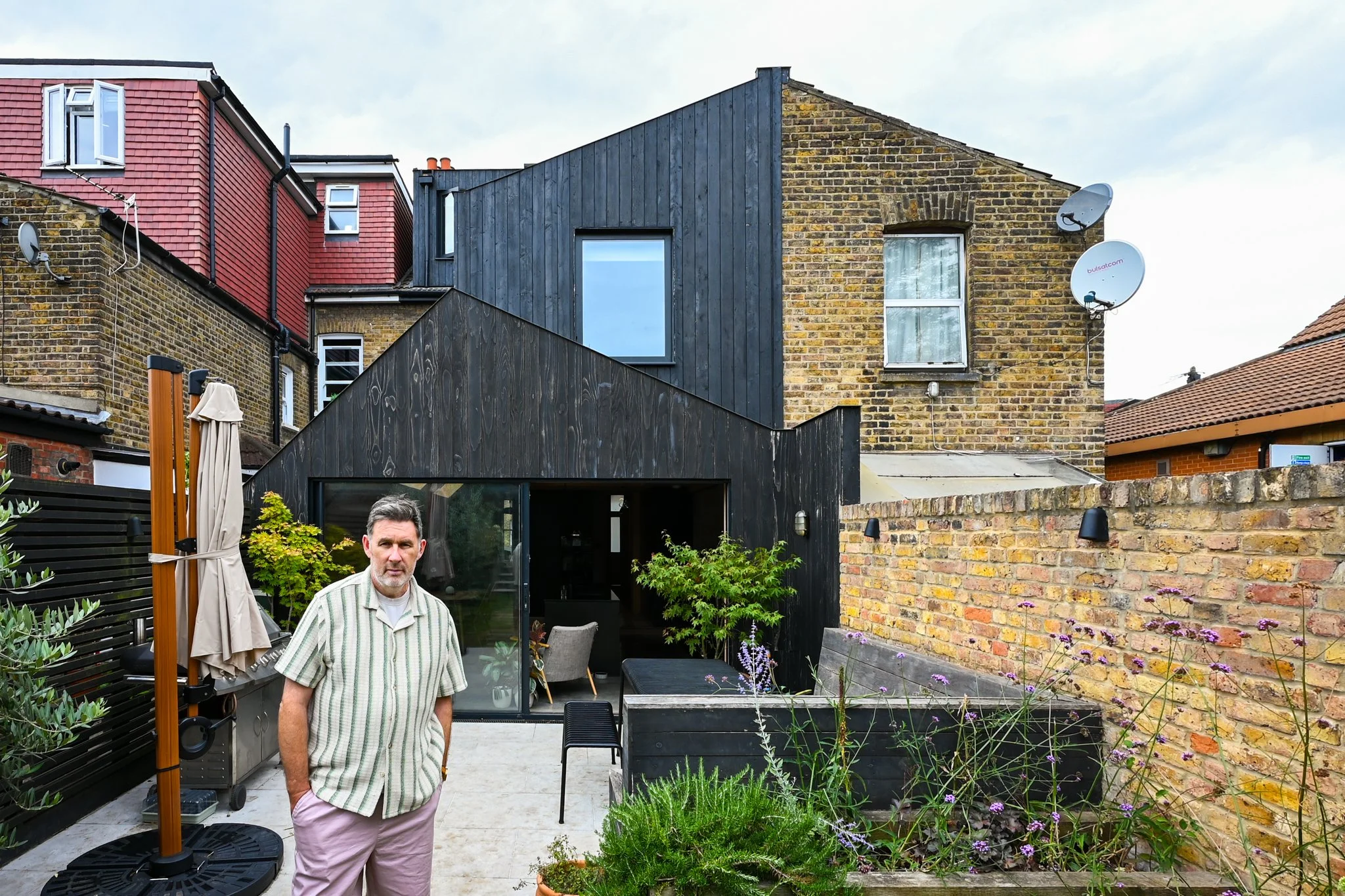 Homeowner & renovator, Mark, in front of his project at Copeland Road, Walhamstow.