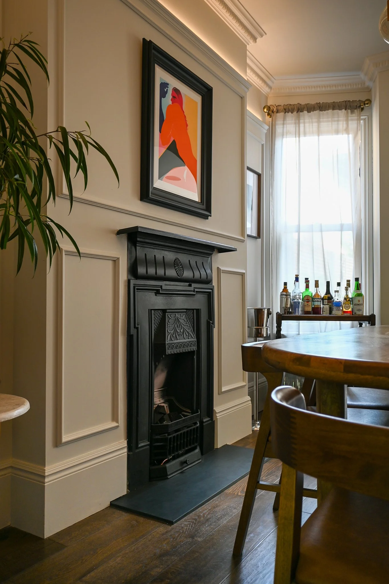 Bottlebrush House - London Terraced Renovation - Dining Room with a period fireplace