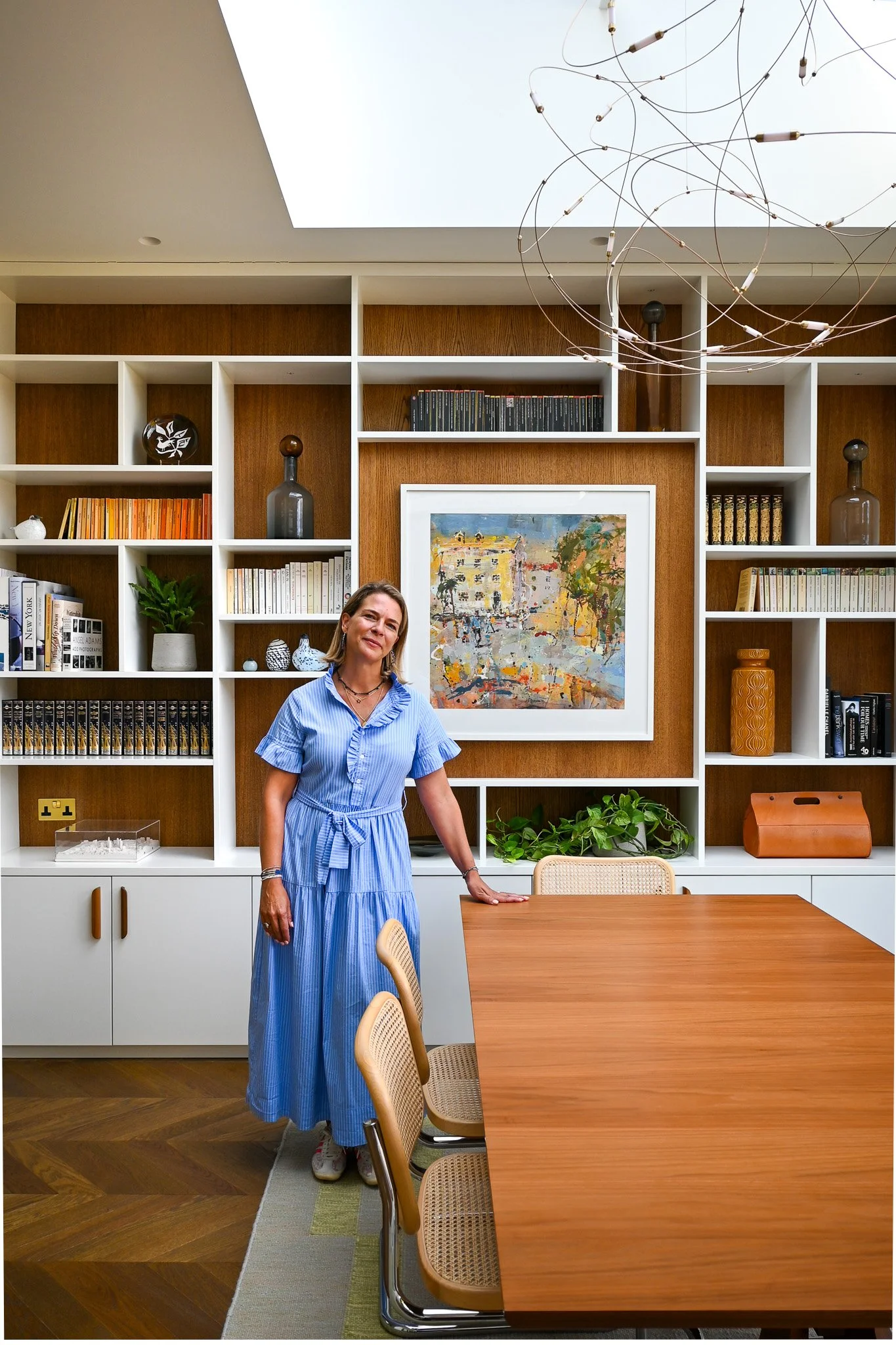 women standing in front of bespoke joinery in dining room