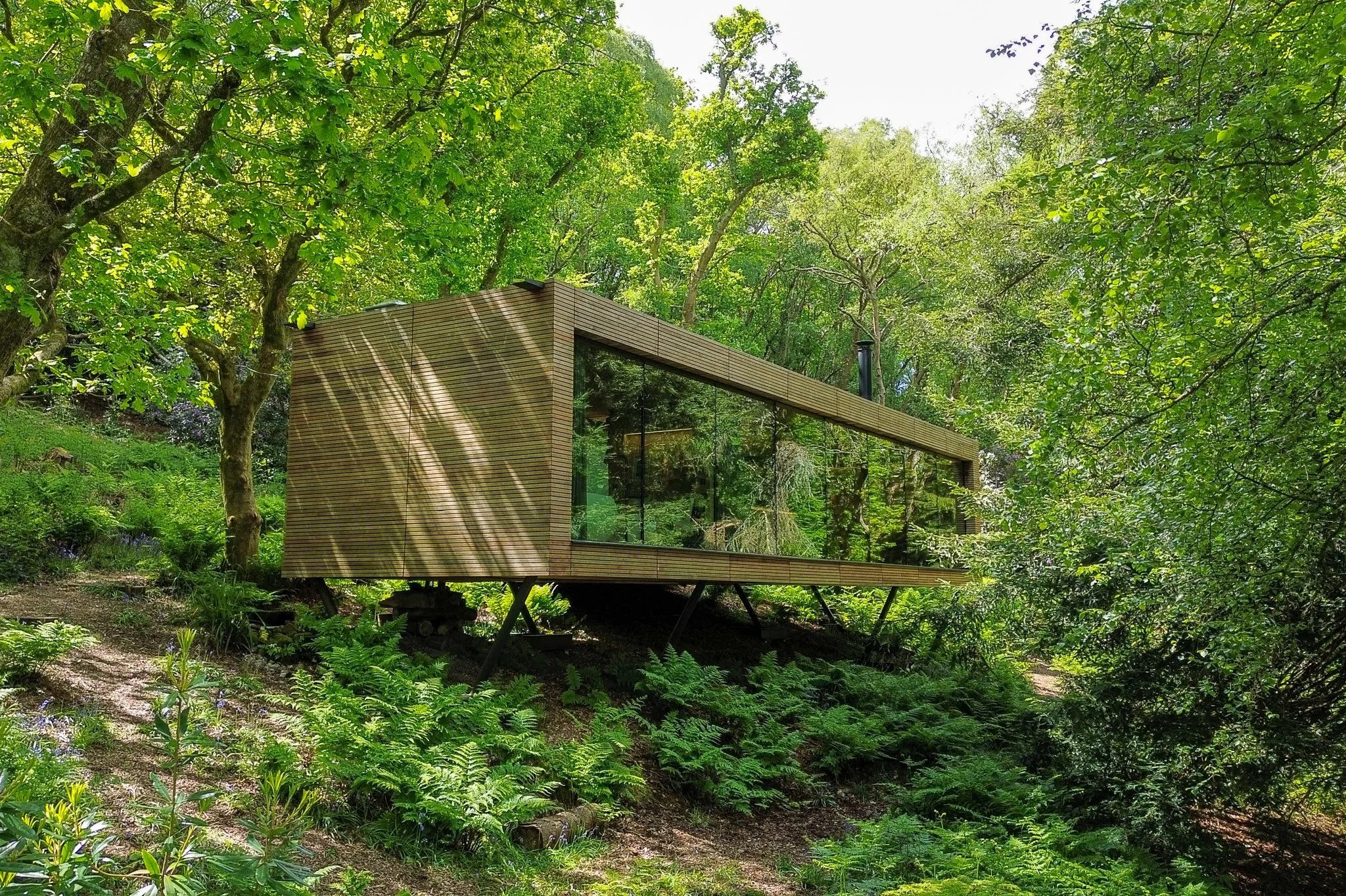 Looking Glass Lodge Front Elevation Aerial Shot Within the Woods