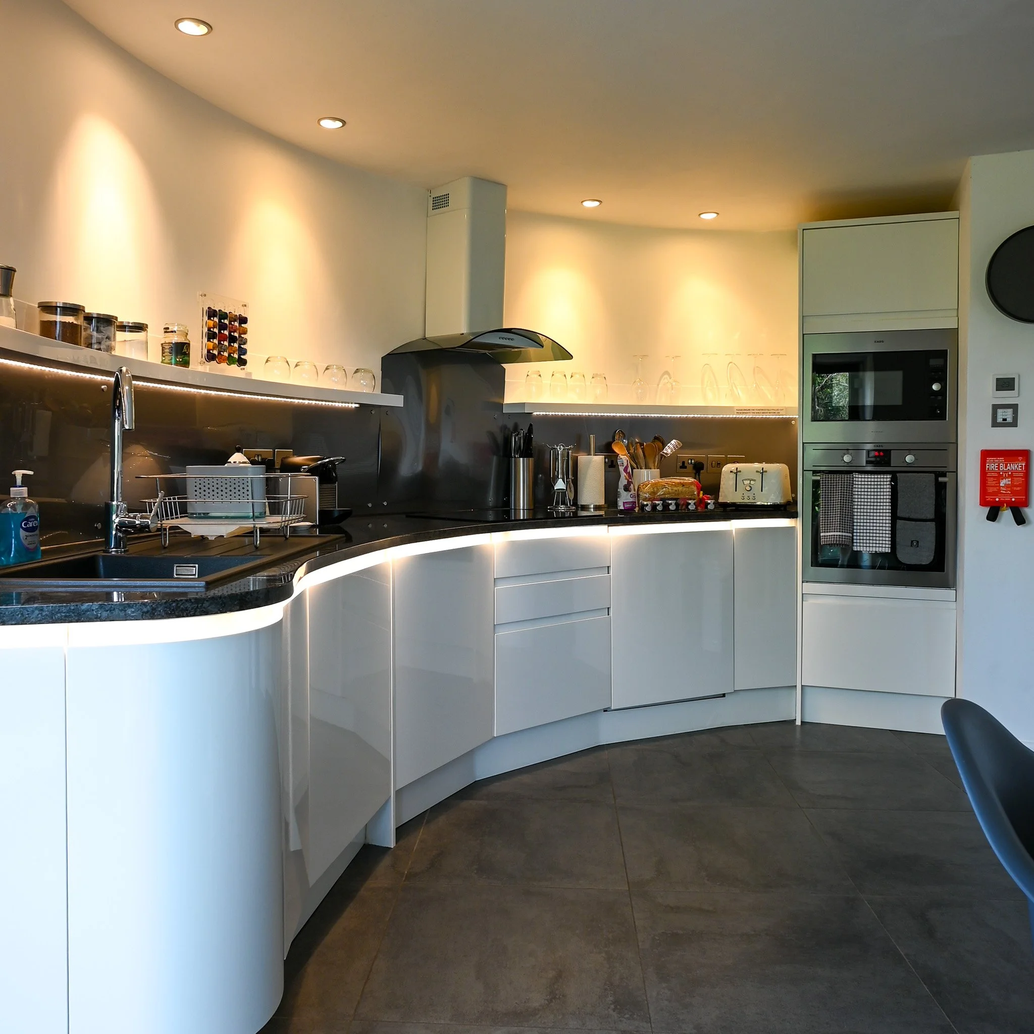circular kitchen with marble top in a converted windmill