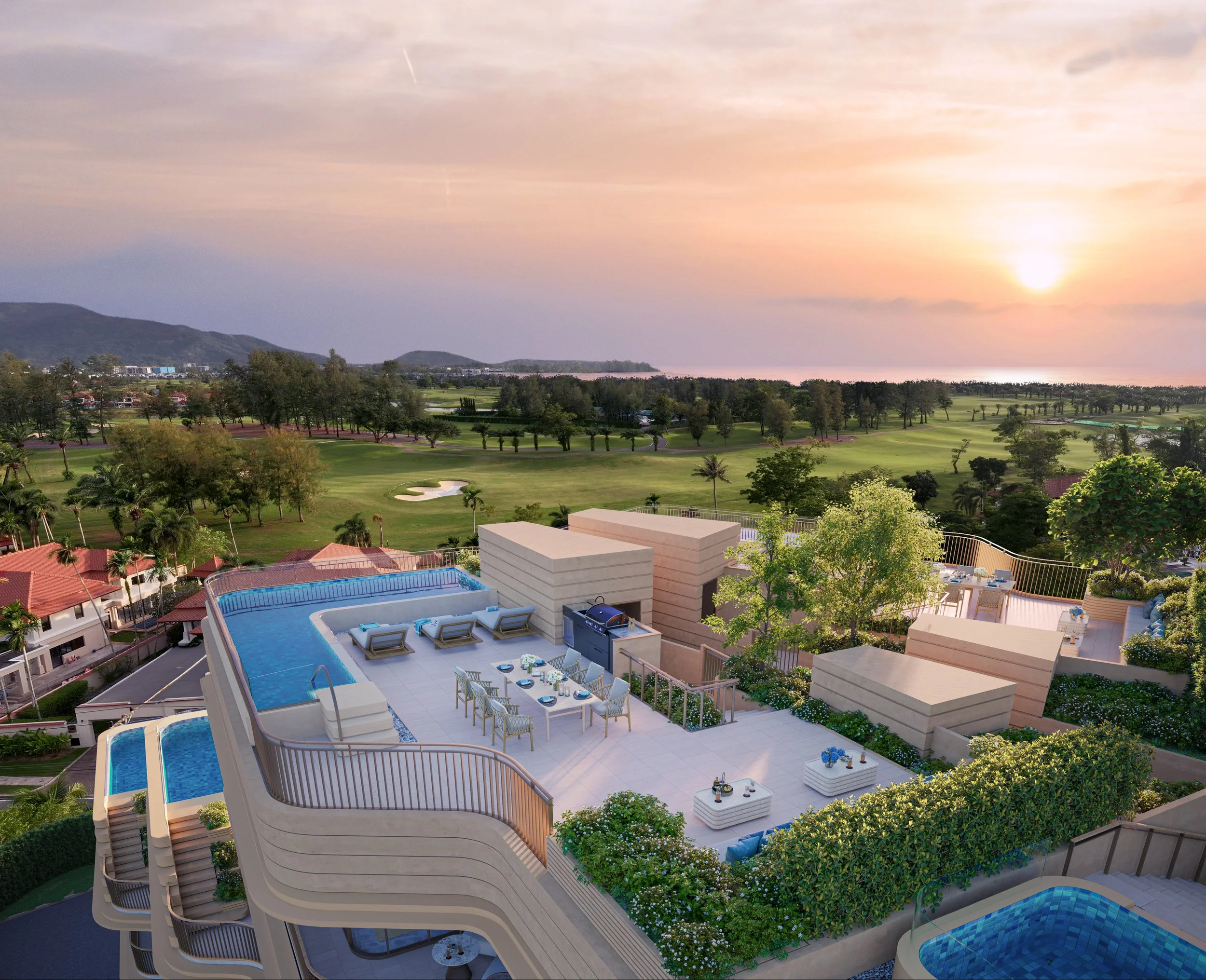 A rooftop pool area with lounge chairs and a dining table, overlooking a golf course and distant hills at sunset.