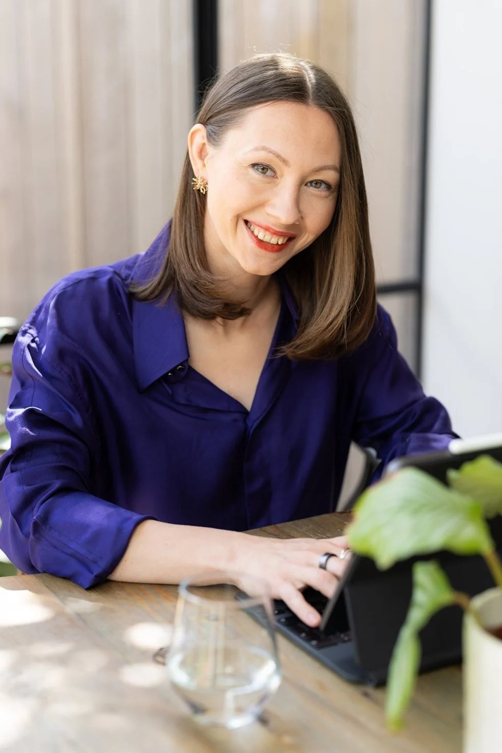 Nutritionist Irina Wolf smiling while on client nutritional consultation call