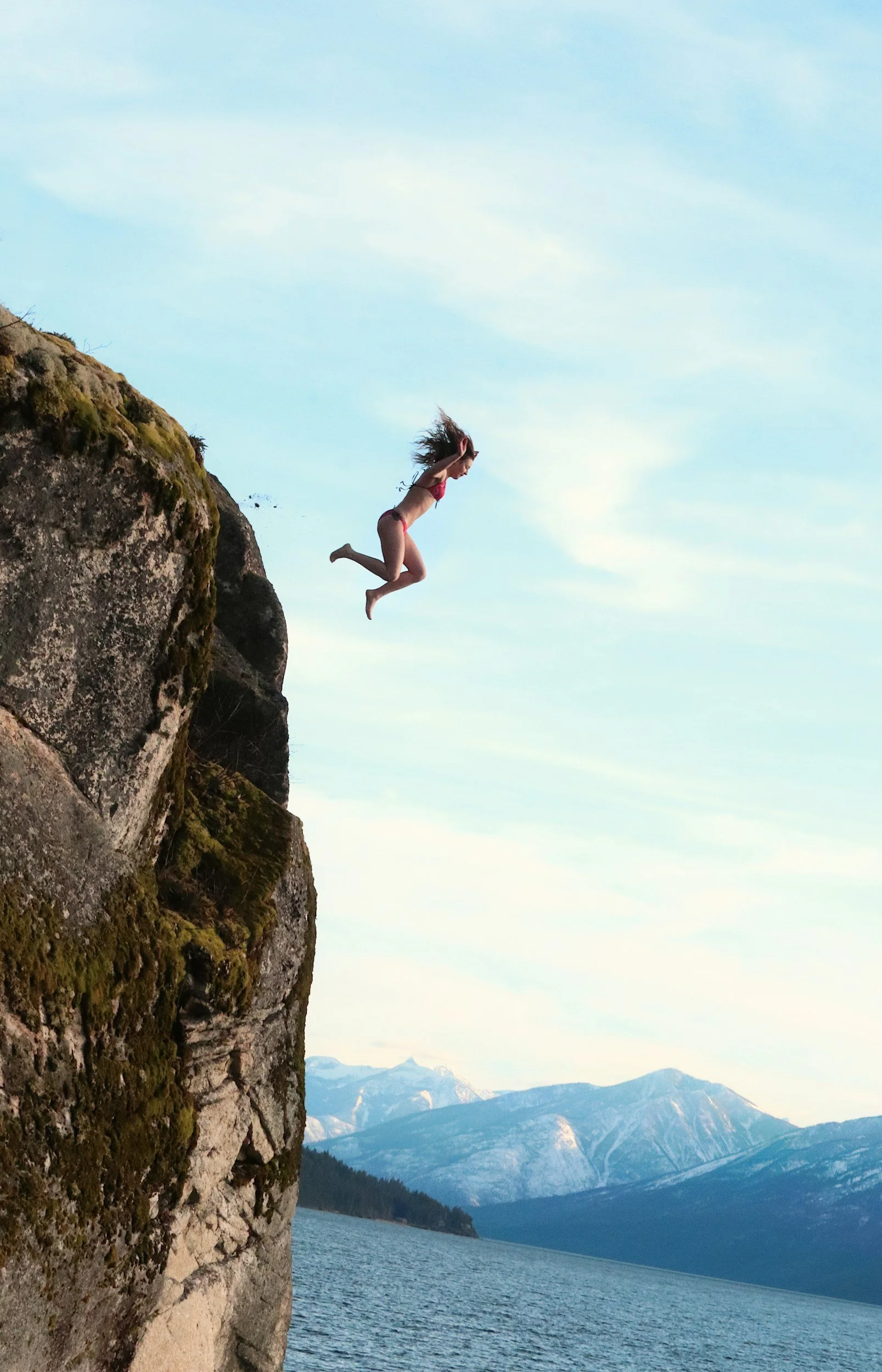 Woman cliff diving when working in nightlife industry