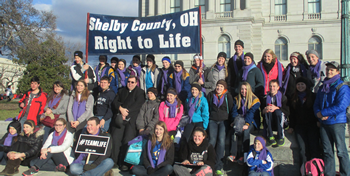 Group of young people gathered in Washington DC holding a Shelby County, Ohio Right to Life banner