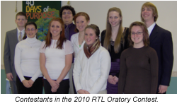 Group of nine young people, including boys and girls, dressed in casual and semi-formal clothing, standing together on a stage with a backdrop that says 'Days of Purpose.'