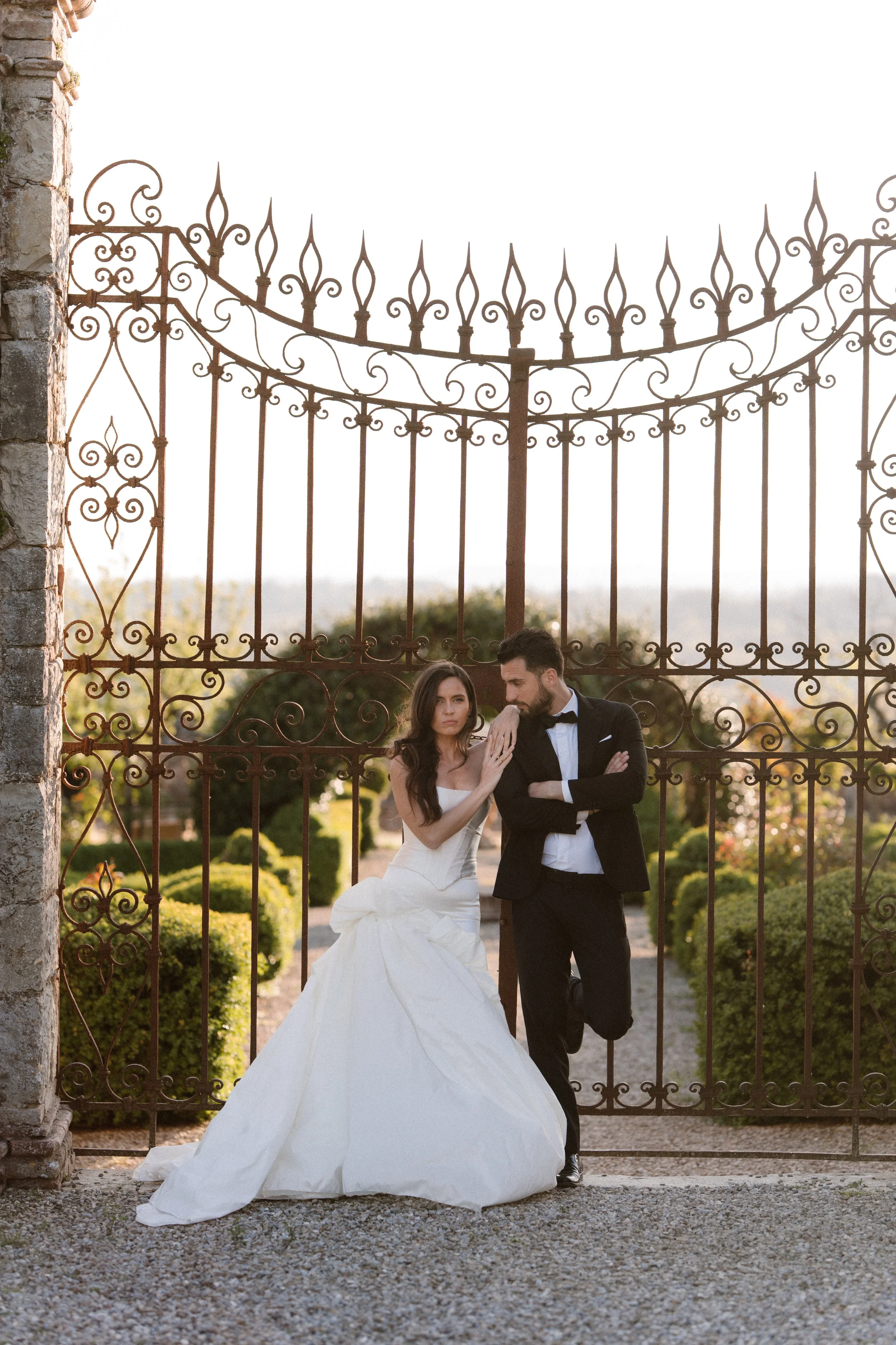 Bride and groom posing at Villa di Geggiano in Italy