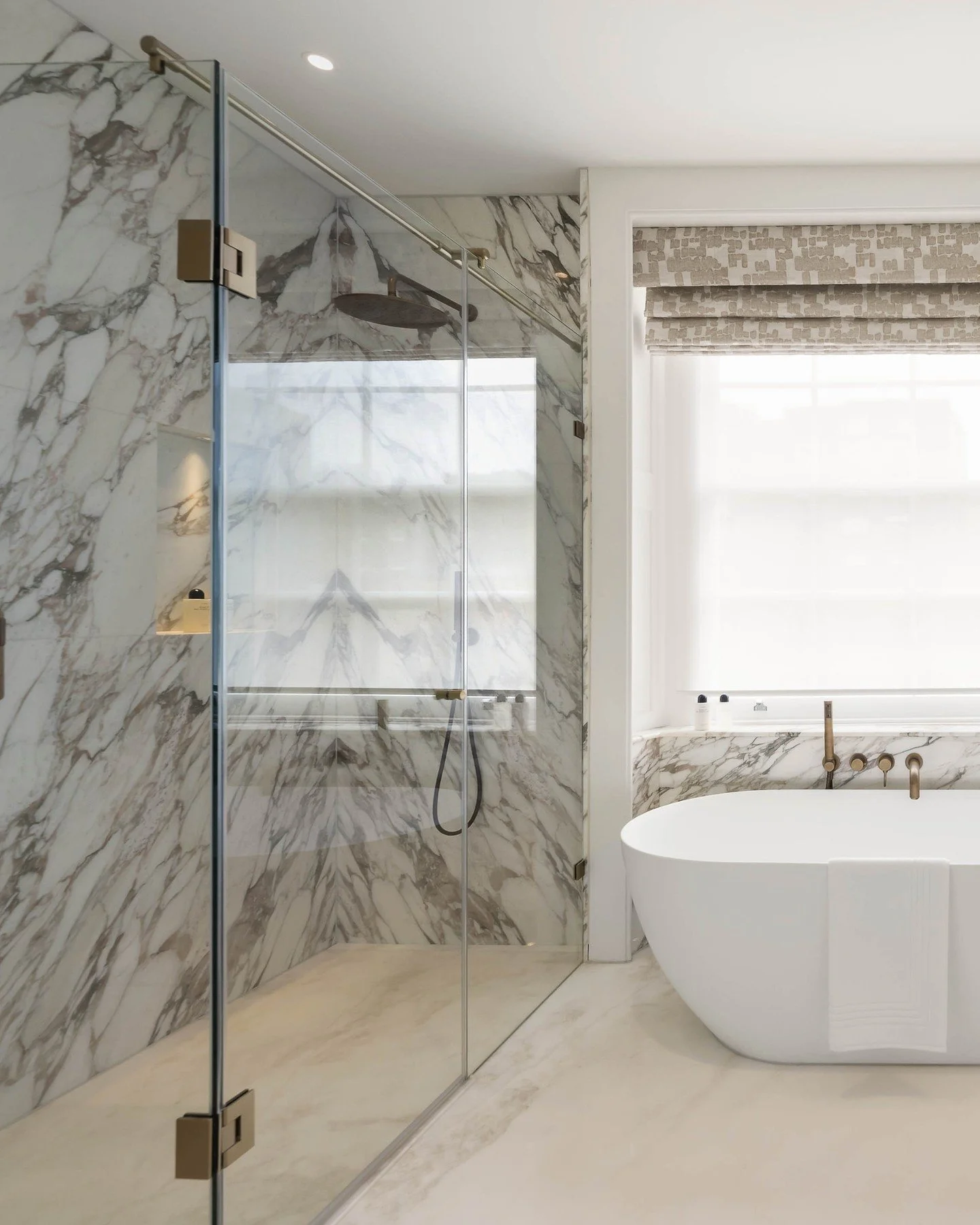 The bathroom - where calm begins and ends each day. A heavily veined marble like this Calacatta Vagli Oro combined with a natural oak timber and neutral floors and walls create a perfect sanctuary from the bustle of everyday life. 

Swipe right to se