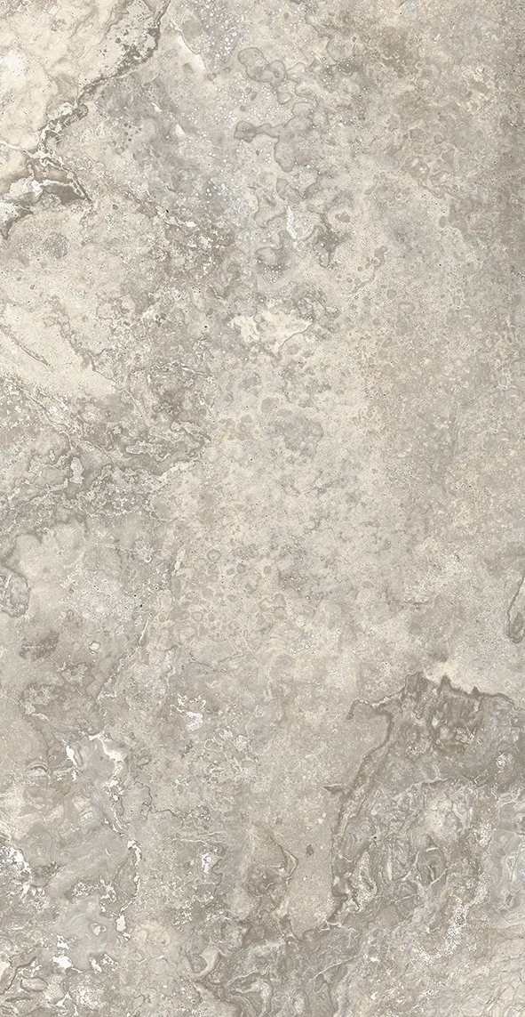 Close-up of gray stone tiles arranged on a floor with visible grout lines.