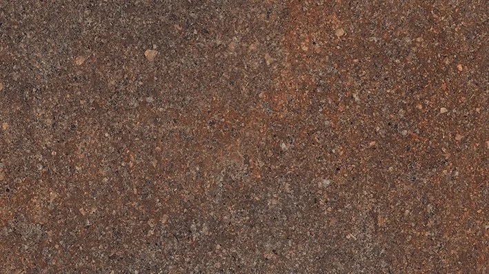 Close-up of a tiled brown stone floor with rectangular tiles and gray grout lines.