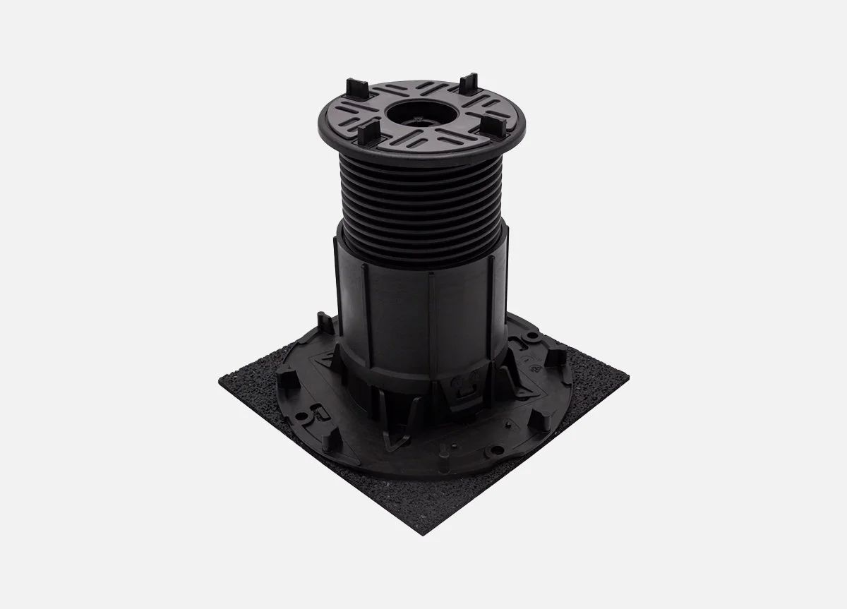 Black adjustable roof flashing with a base and a flexible, ribbed pipe for sealing around a roof pipe or vent.