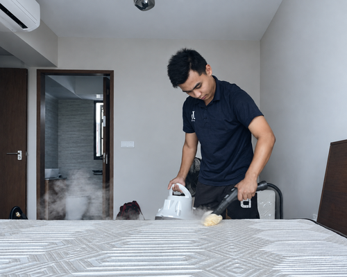 J+U team member cleaning a mattress