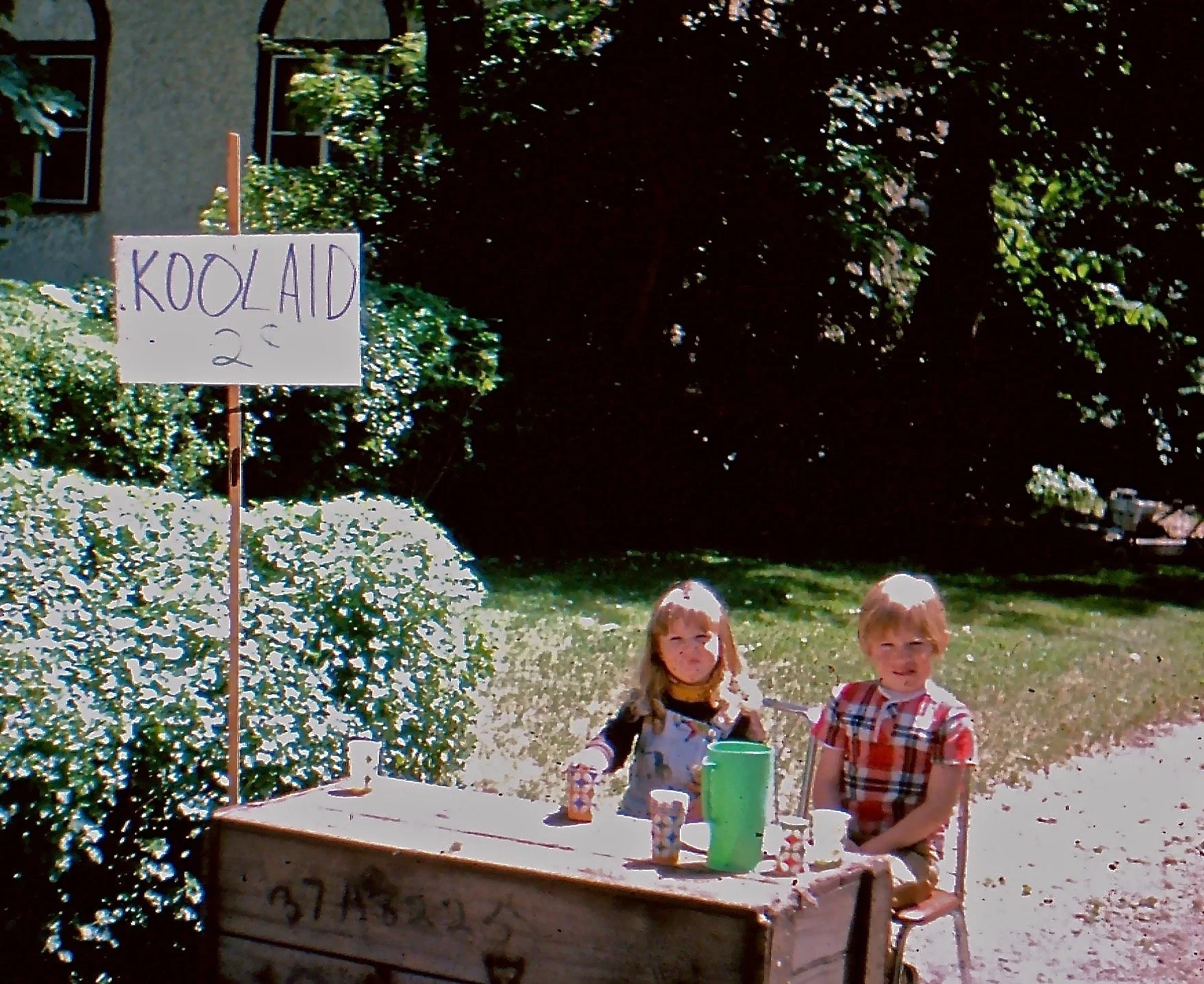 4 year old megan and her brother selling koolaid at a stand
