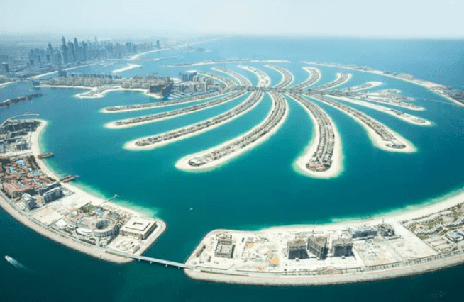 Aerial view of Palm Jumeirah, artificial archipelago in Dubai, shaped like a palm tree with fronds.