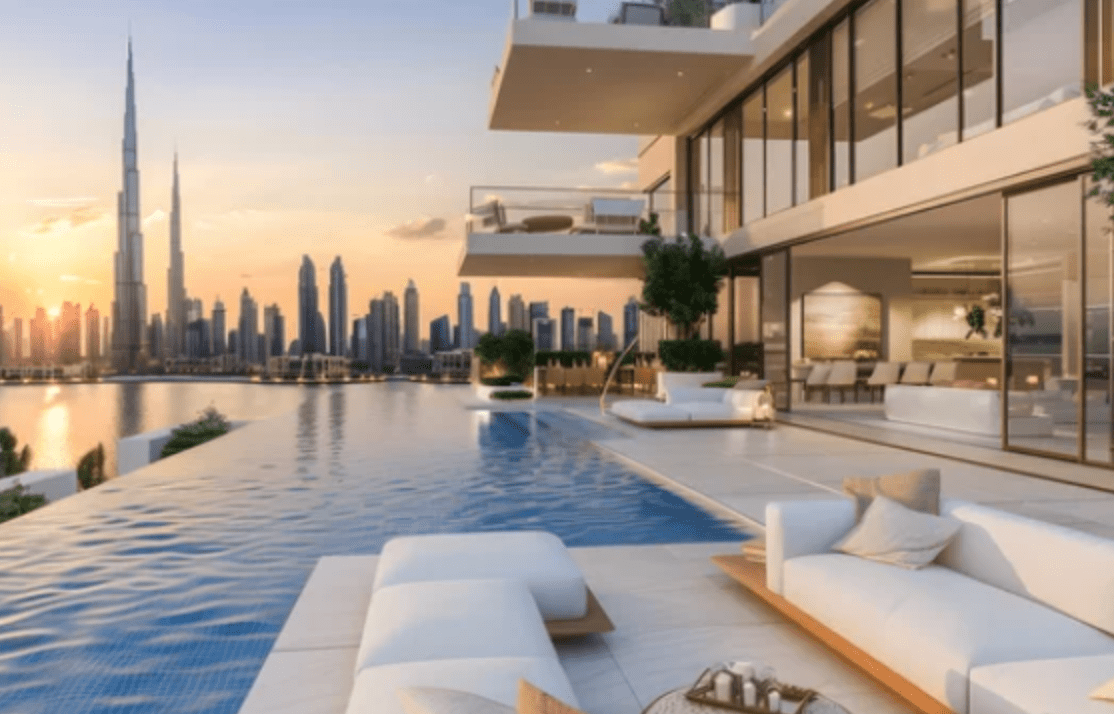Luxury outdoor terrace with infinity pool overlooking city skyline at sunset.