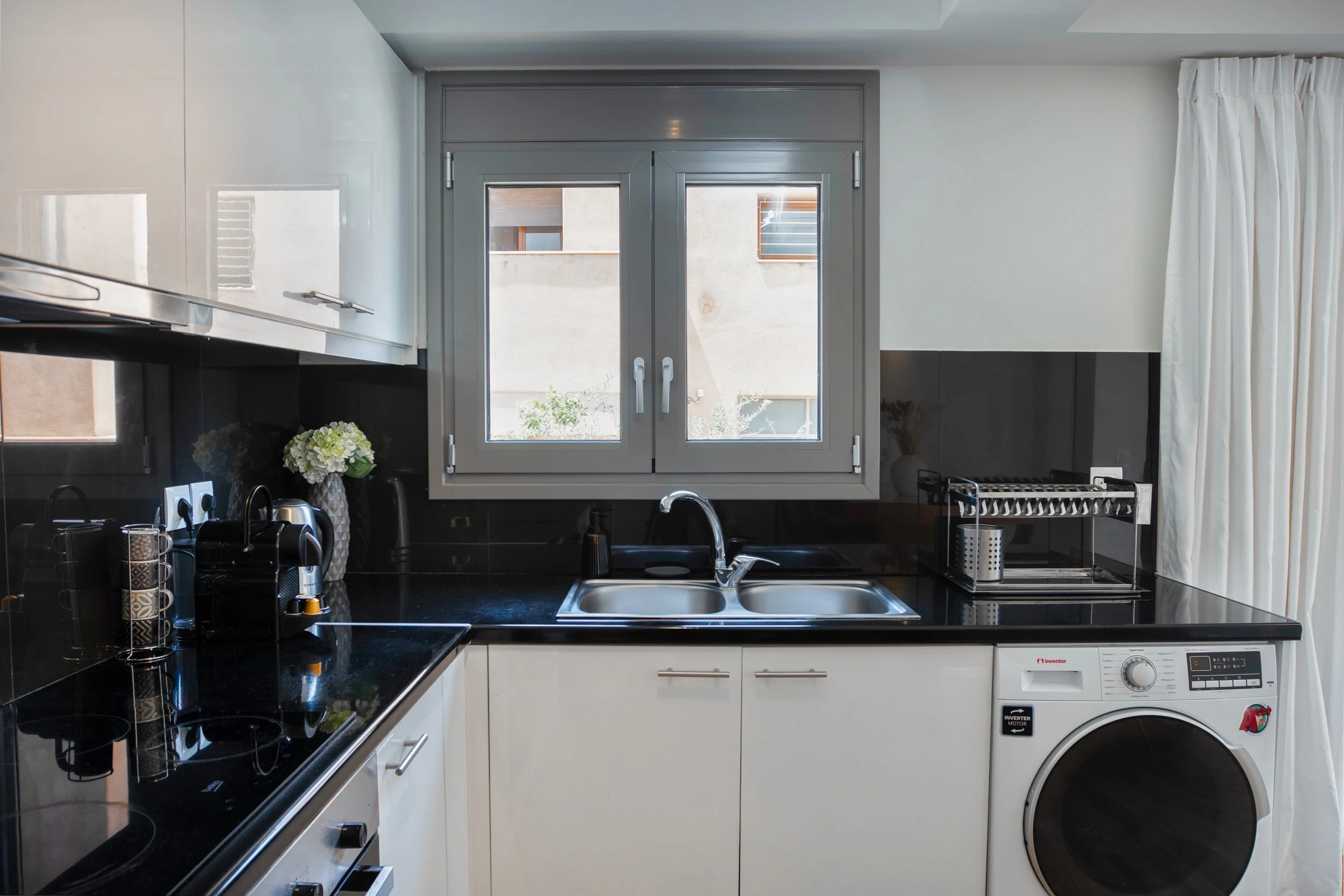 Kitchen — sink, dual windows and washer