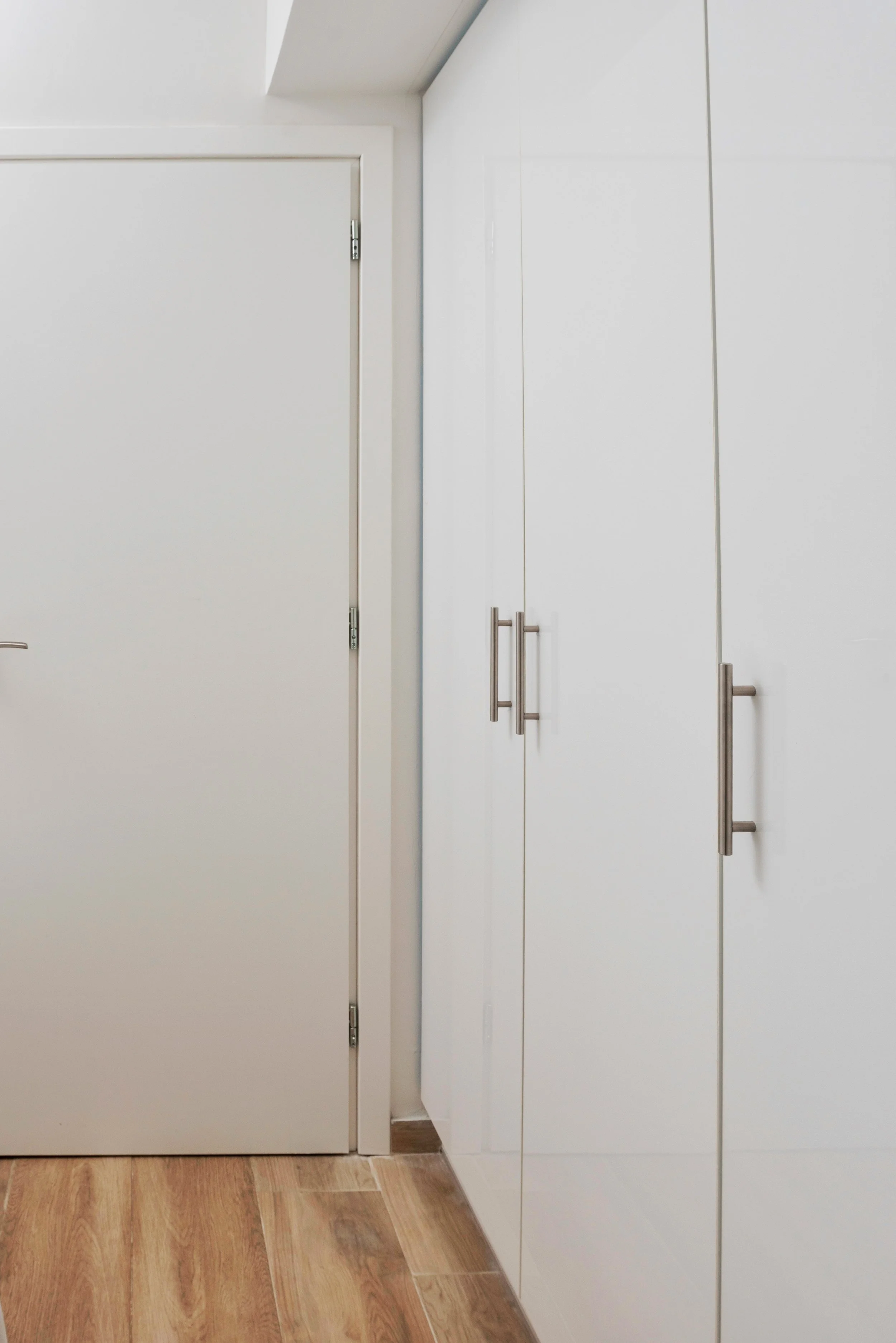 Hallway with floor-to-ceiling closets