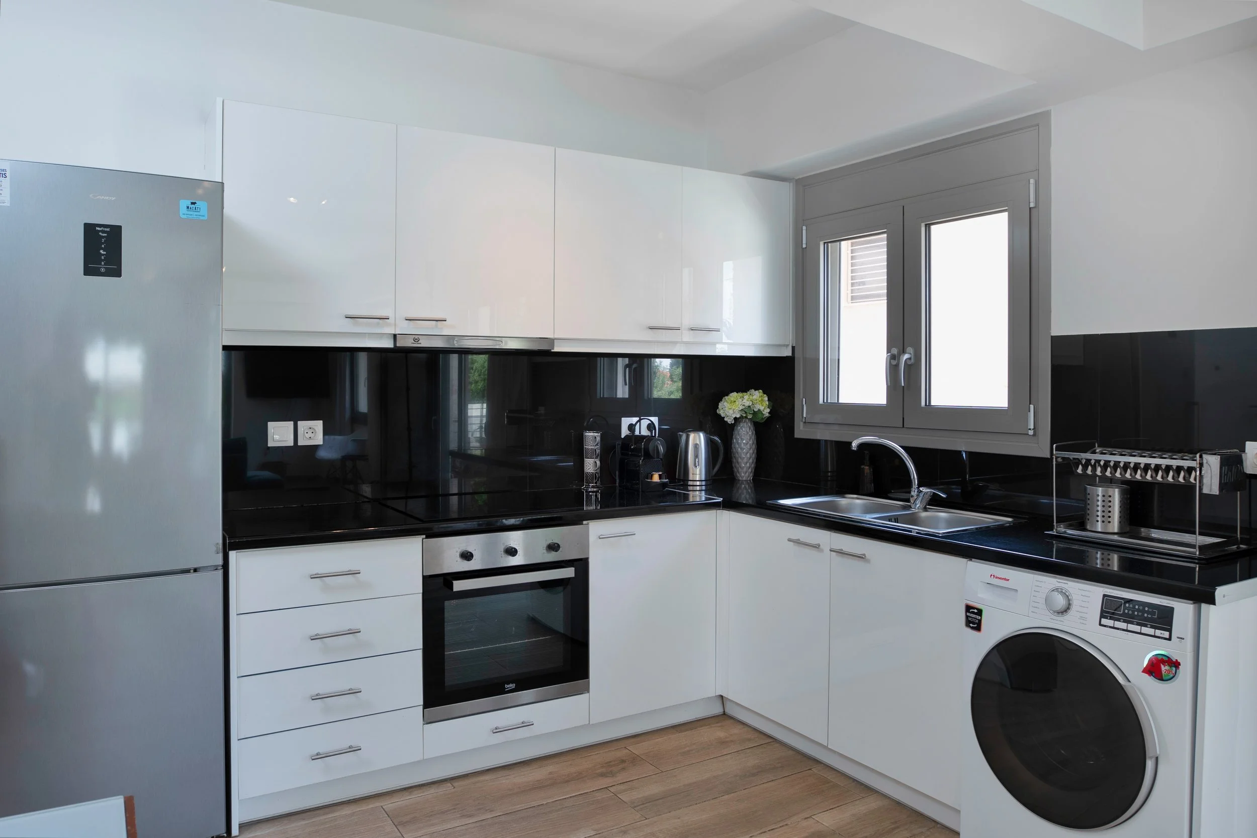 Kitchen — oven, hob and espresso setup