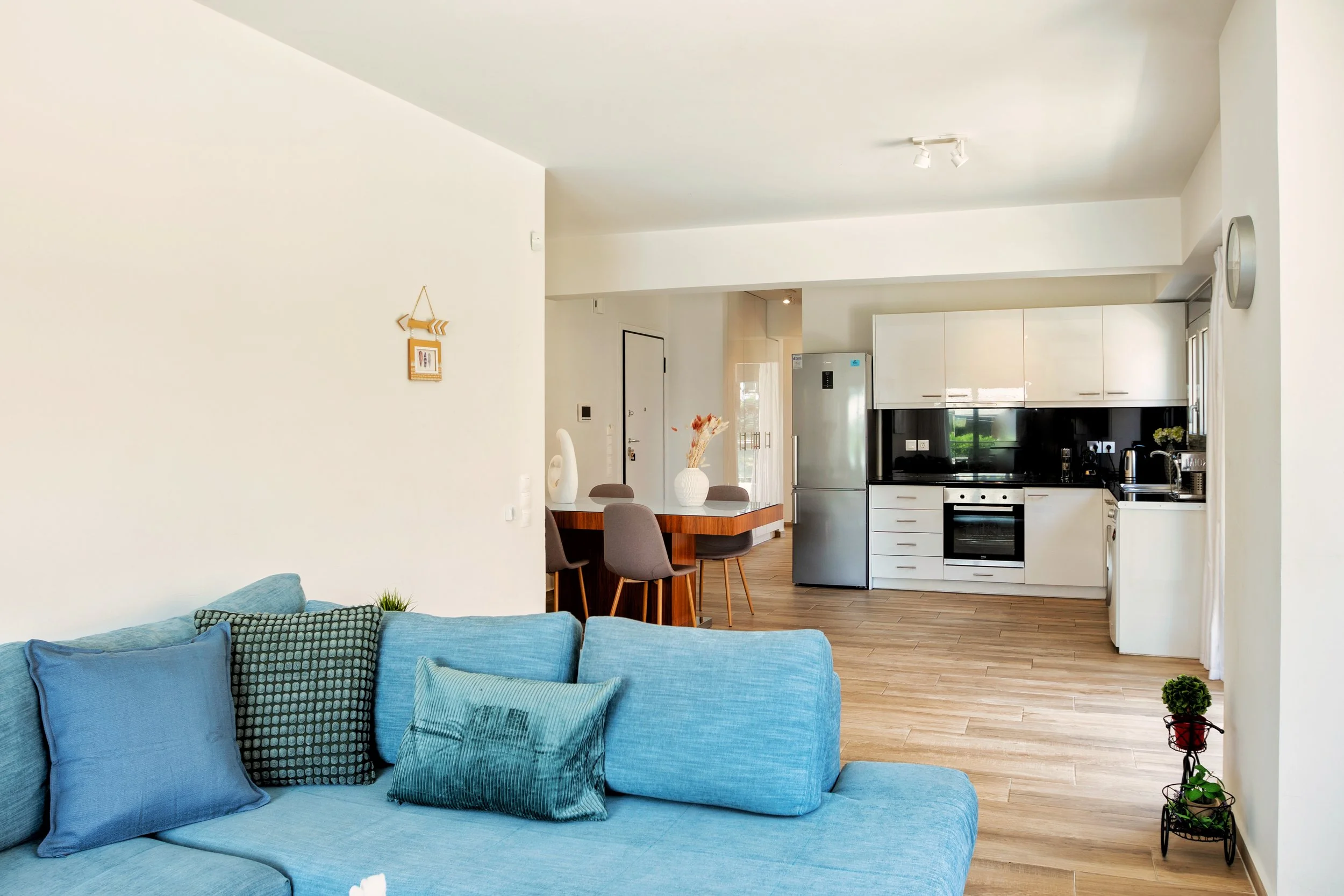 Living, dining, and kitchen — wide view