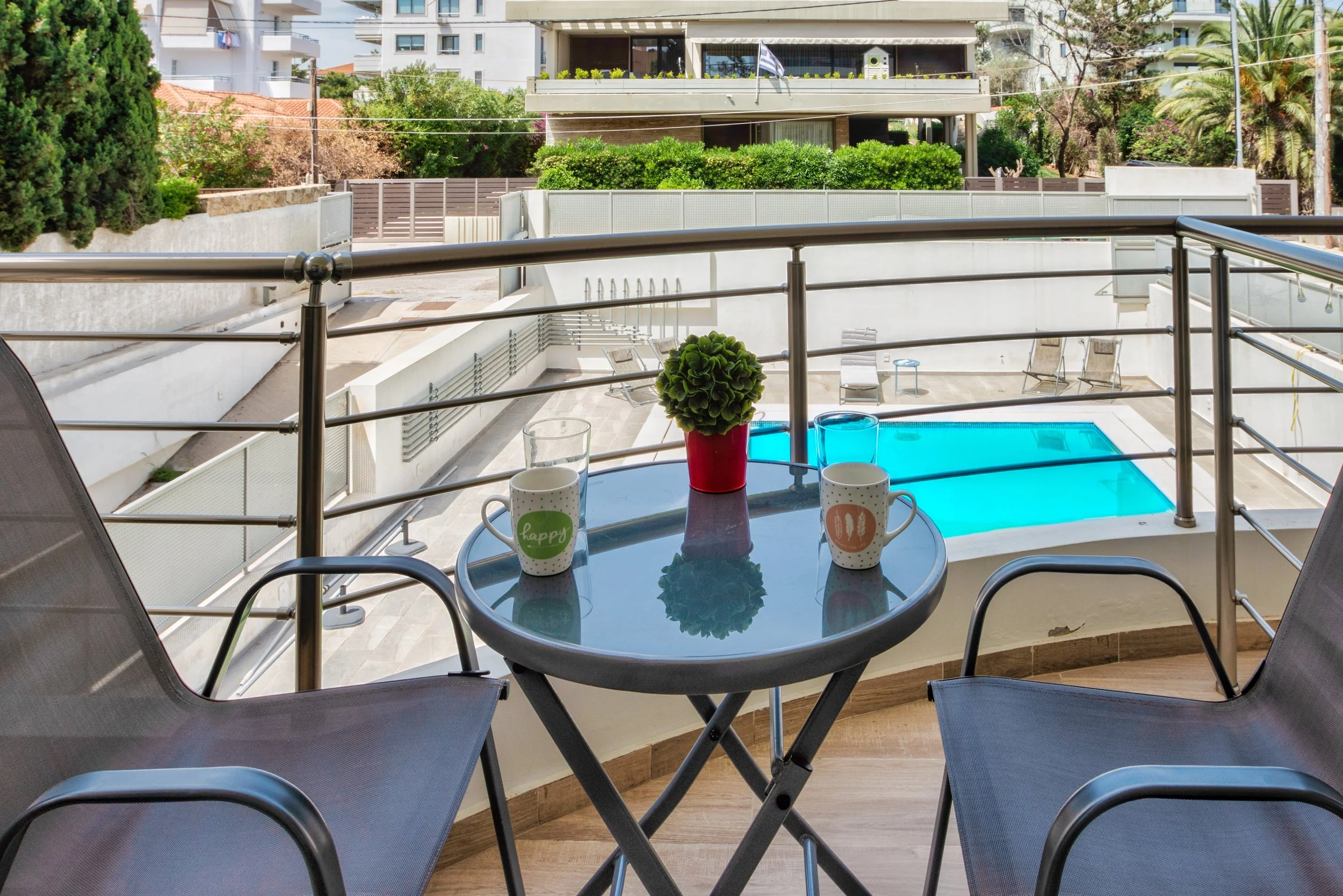 Balcony seating with pool view below