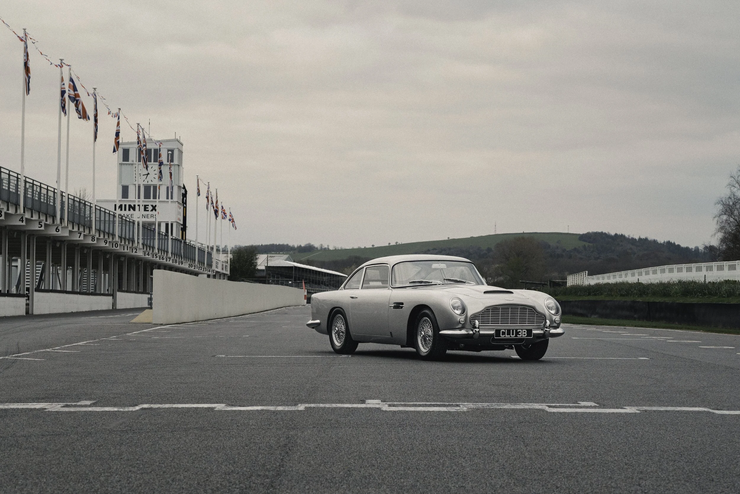 vintage car Aston Martin db5 standing on the start line of Goodwood motor circuit