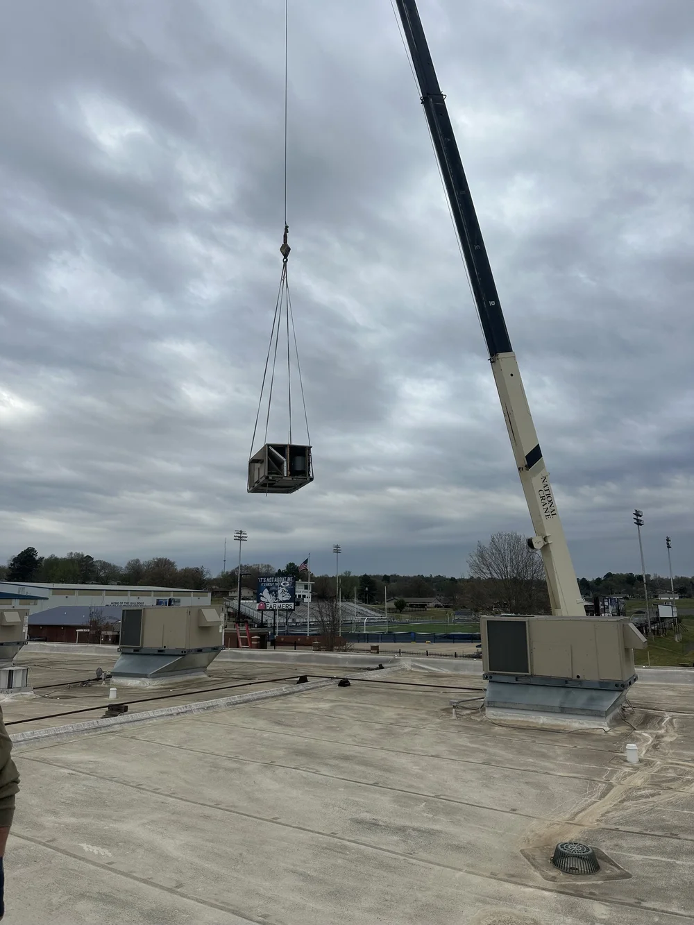 Clark HVAC service trucks on a commercial job site