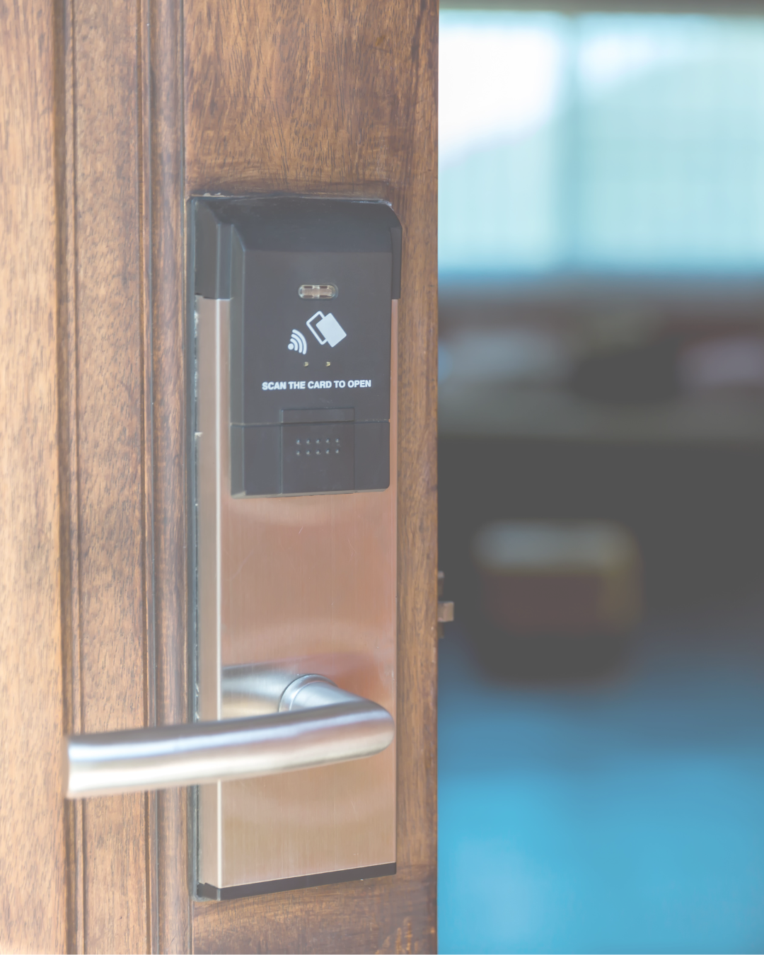 Smart electronic door lock with key card scanner on wooden door.