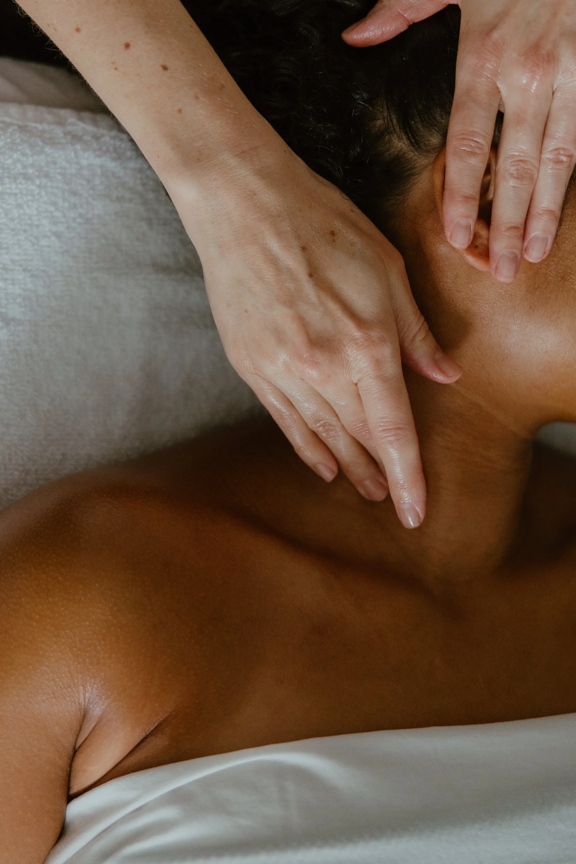 Close up image of a woman receiving a facial massage from Suzy at Urban Holistic in Hamilton