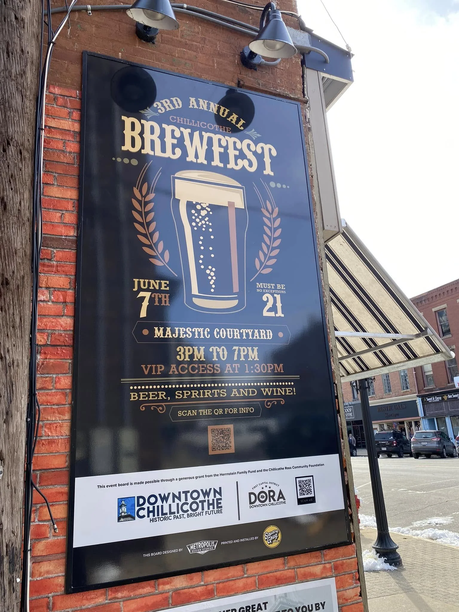Poster for 3rd Annual Chillicothe Brewfest on a building exterior, detailing event on June 7th, 3 PM to 7 PM, at the Majestic Courtyard with beer, spirits, and wine.