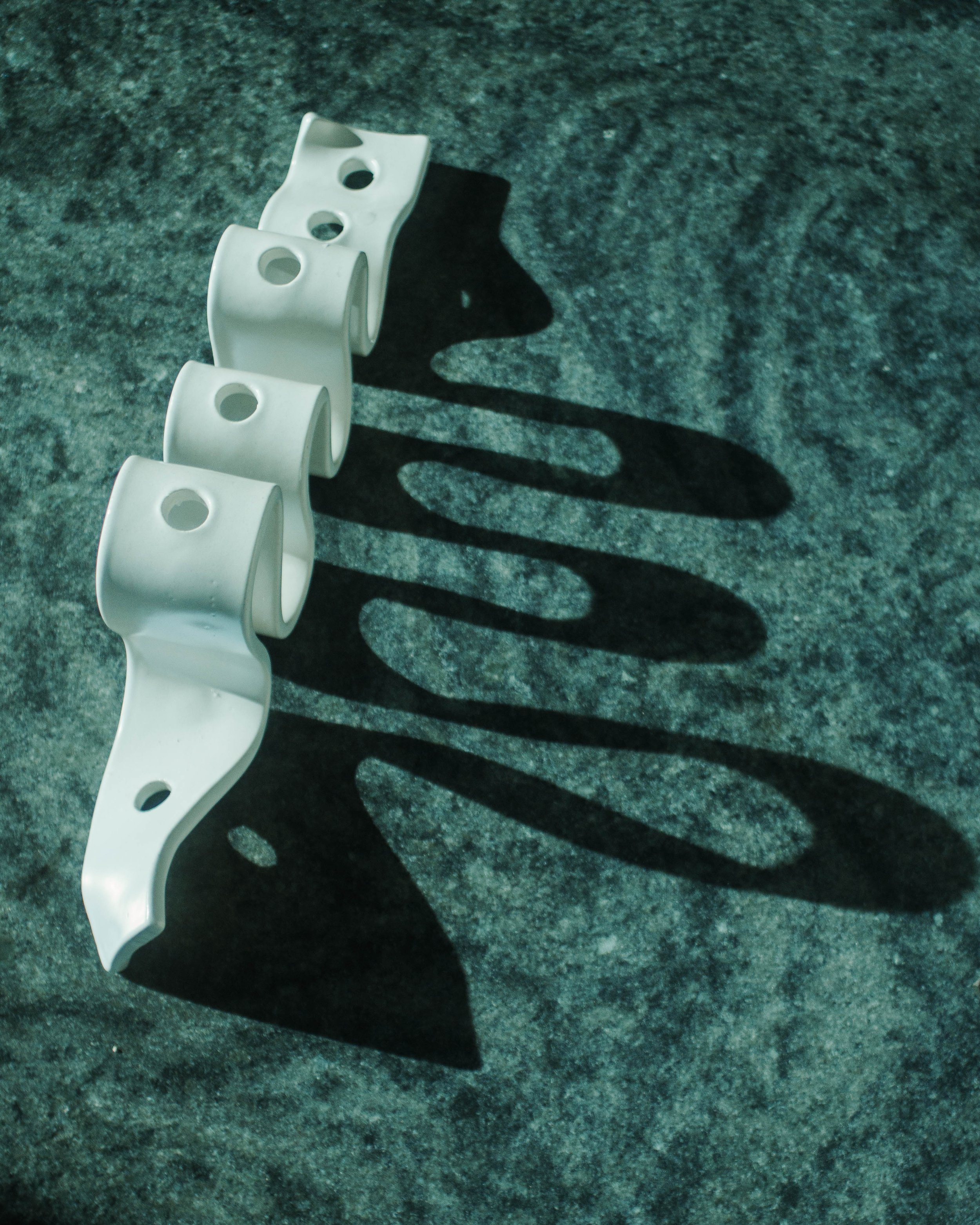 Top view of the Weylyn Candle Holder and the shadows the unique wave form creates