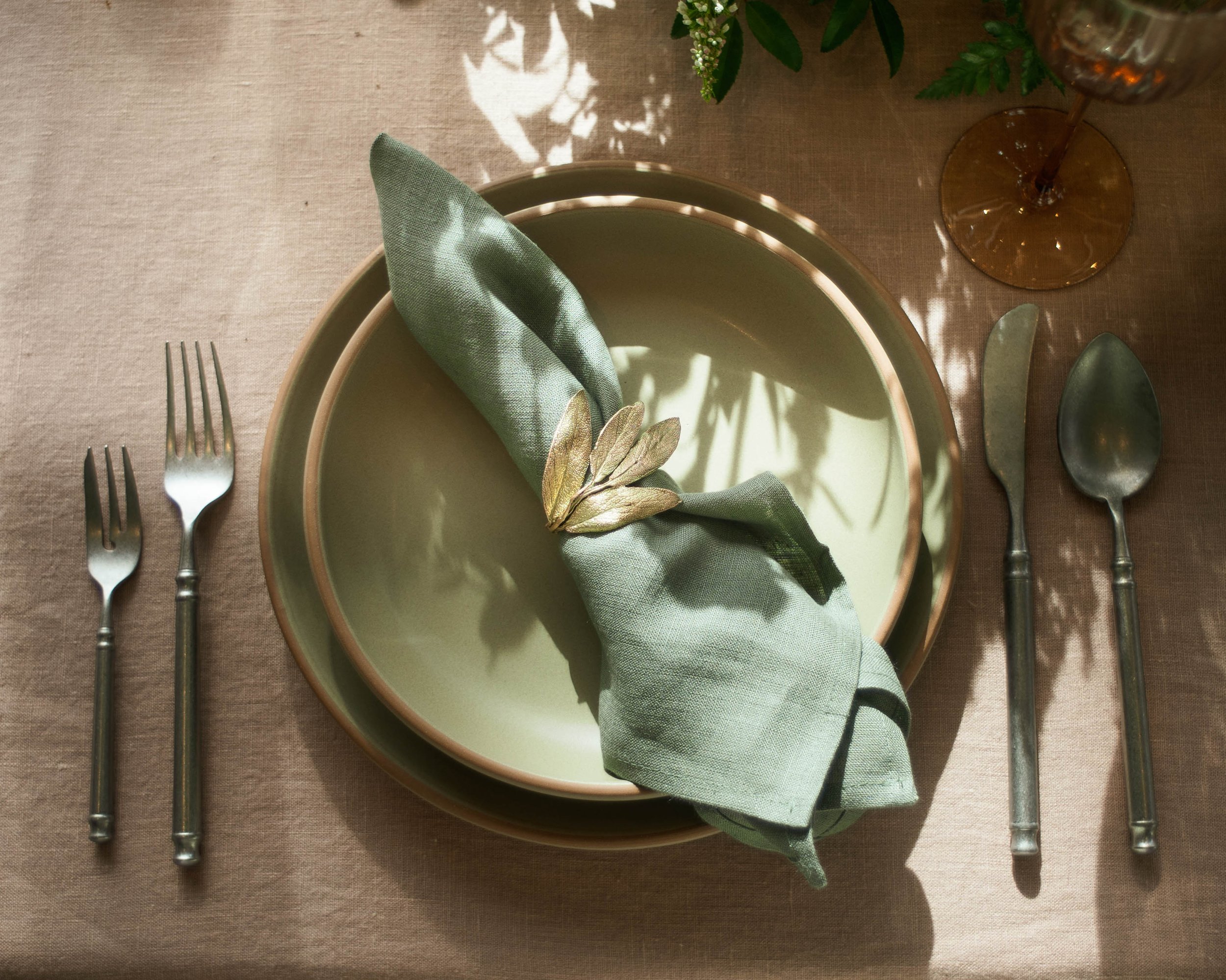 Dinner place setting featuring the Herb Assorted Napkin Rings